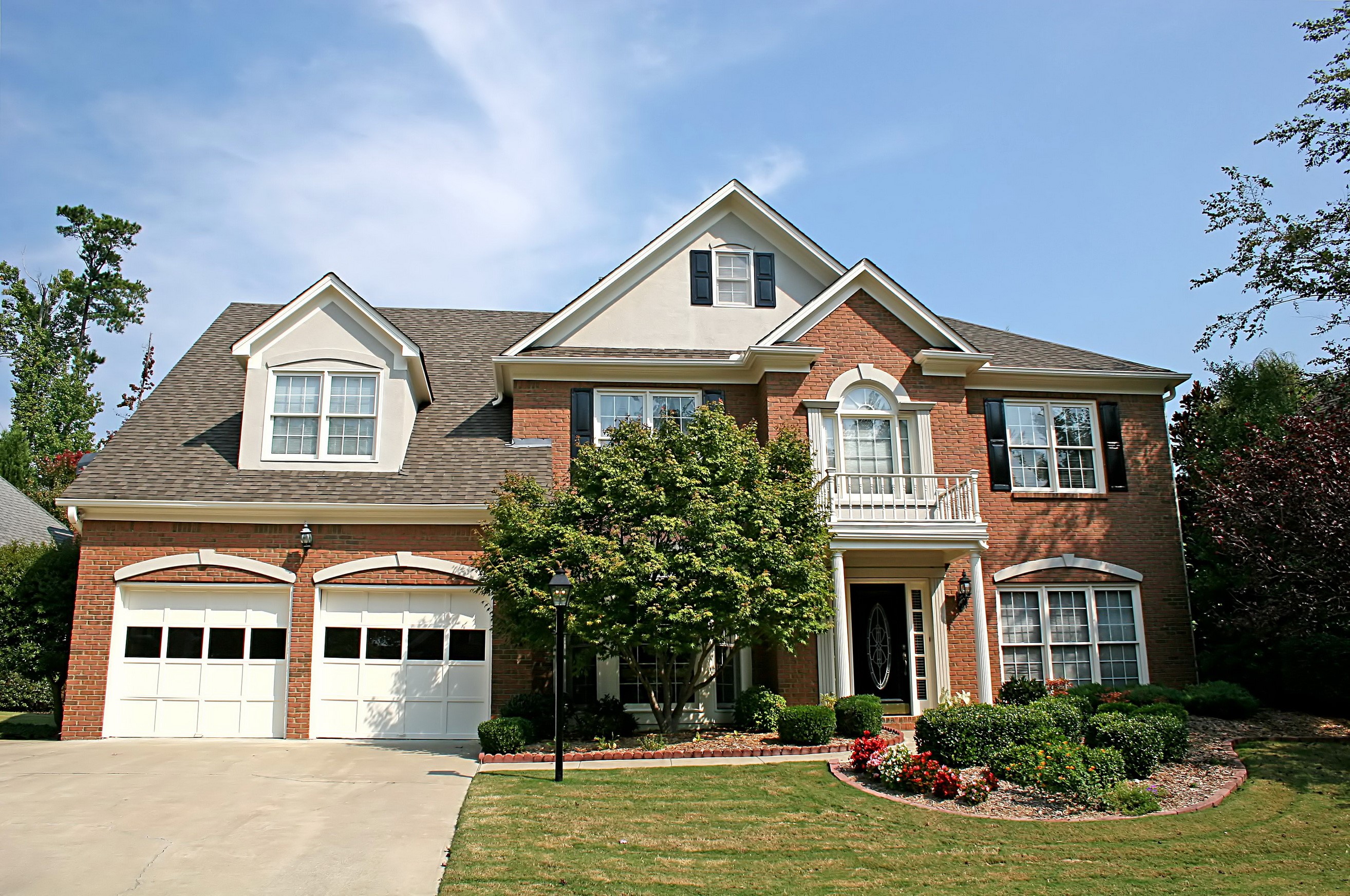 Brick house with garage and balcony HD Wallpaper