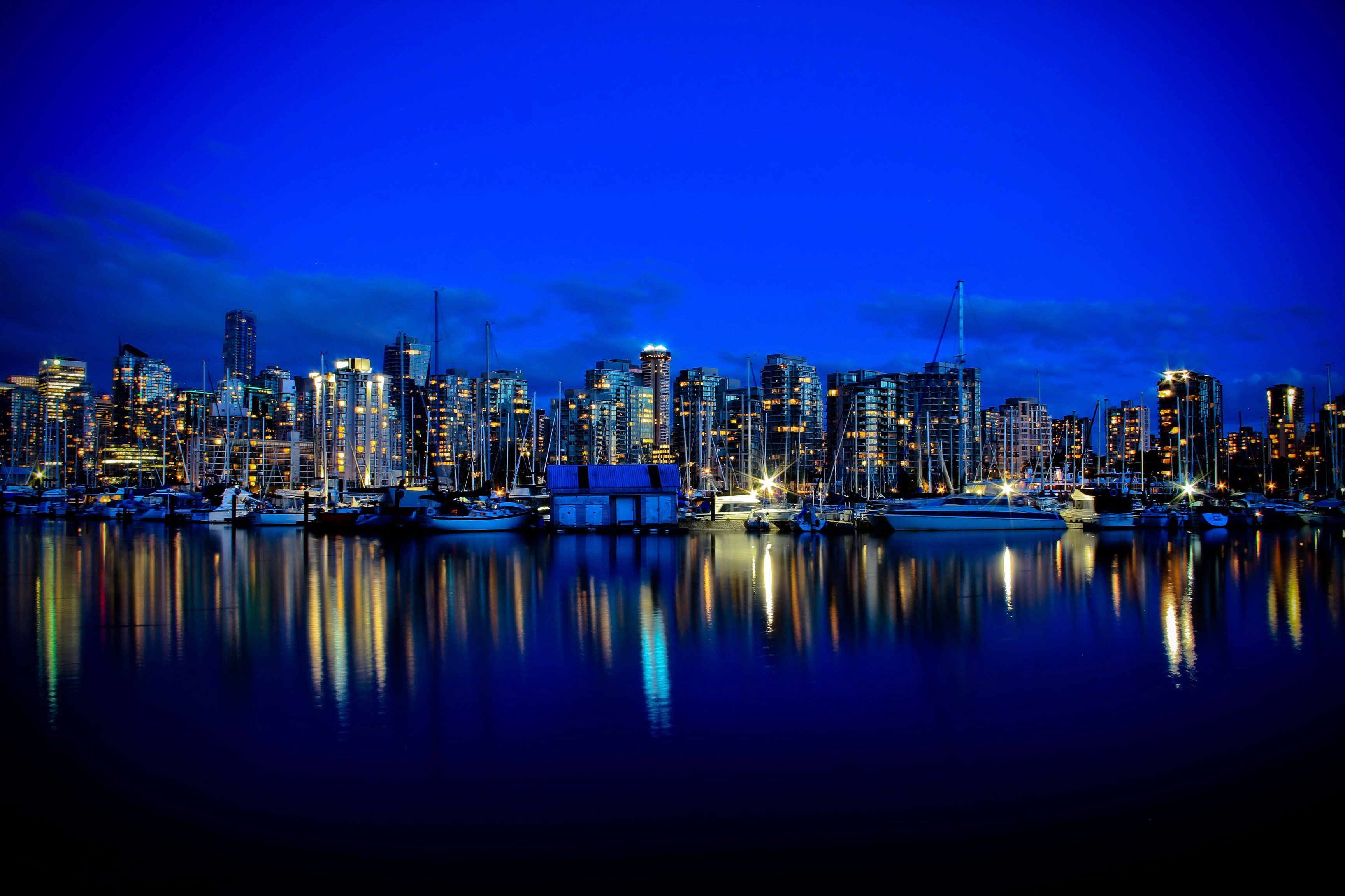 Vancouver skyline at night with reflections HD Wallpaper