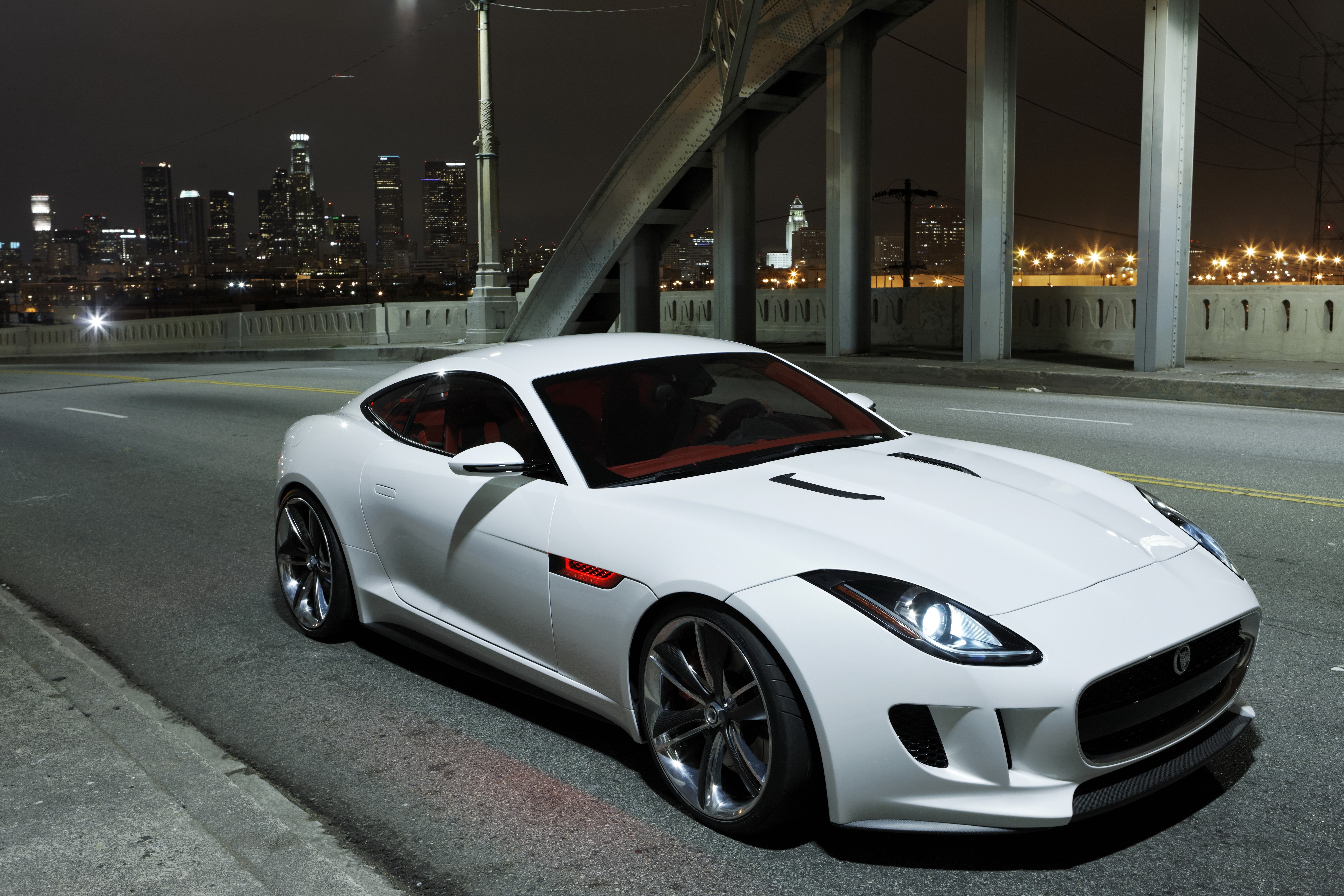 White Jaguar C-X16 concept car on a bridge at night HD Wallpaper
