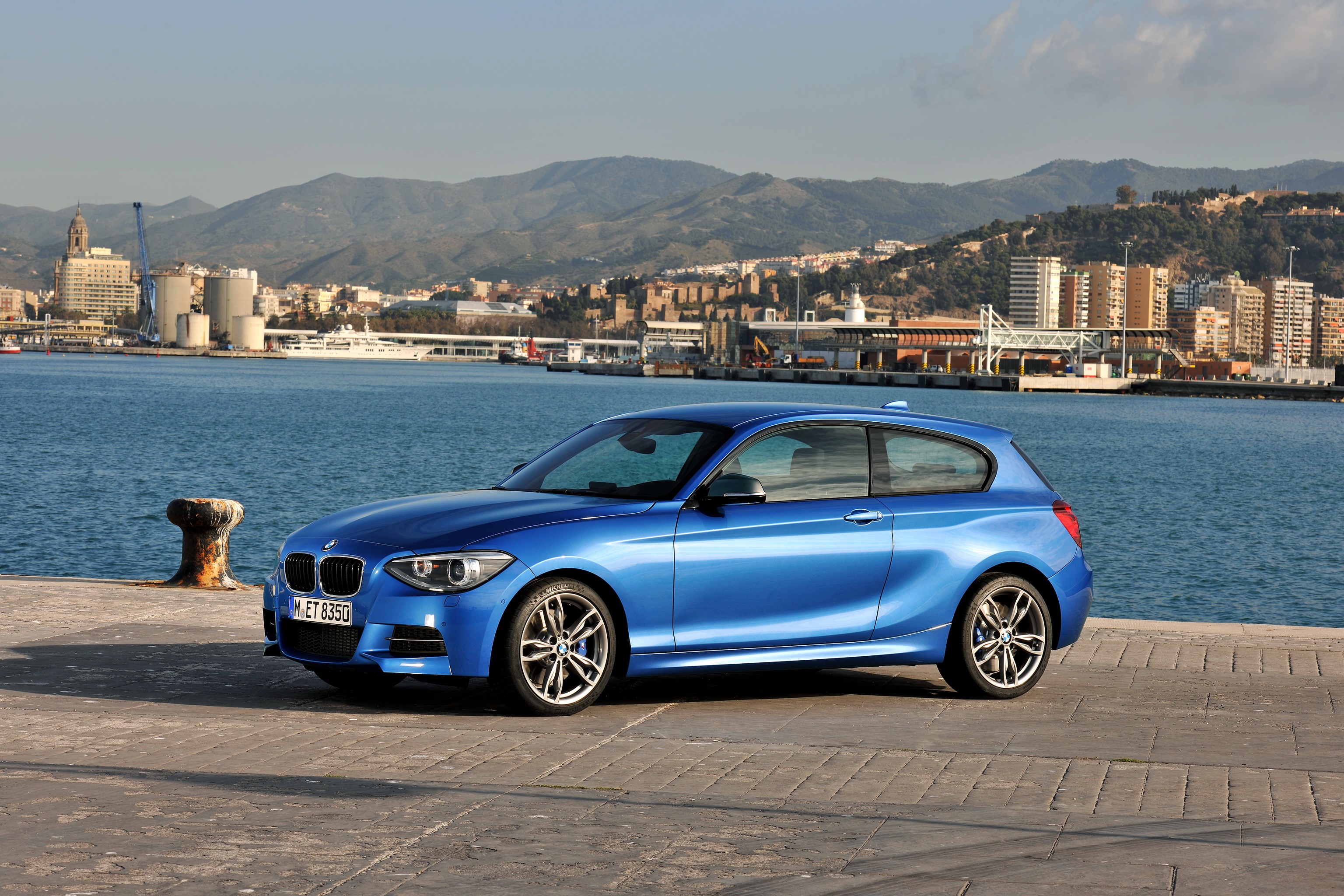 Blue 2012 BMW M135i (F21) parked by the water HD Wallpaper