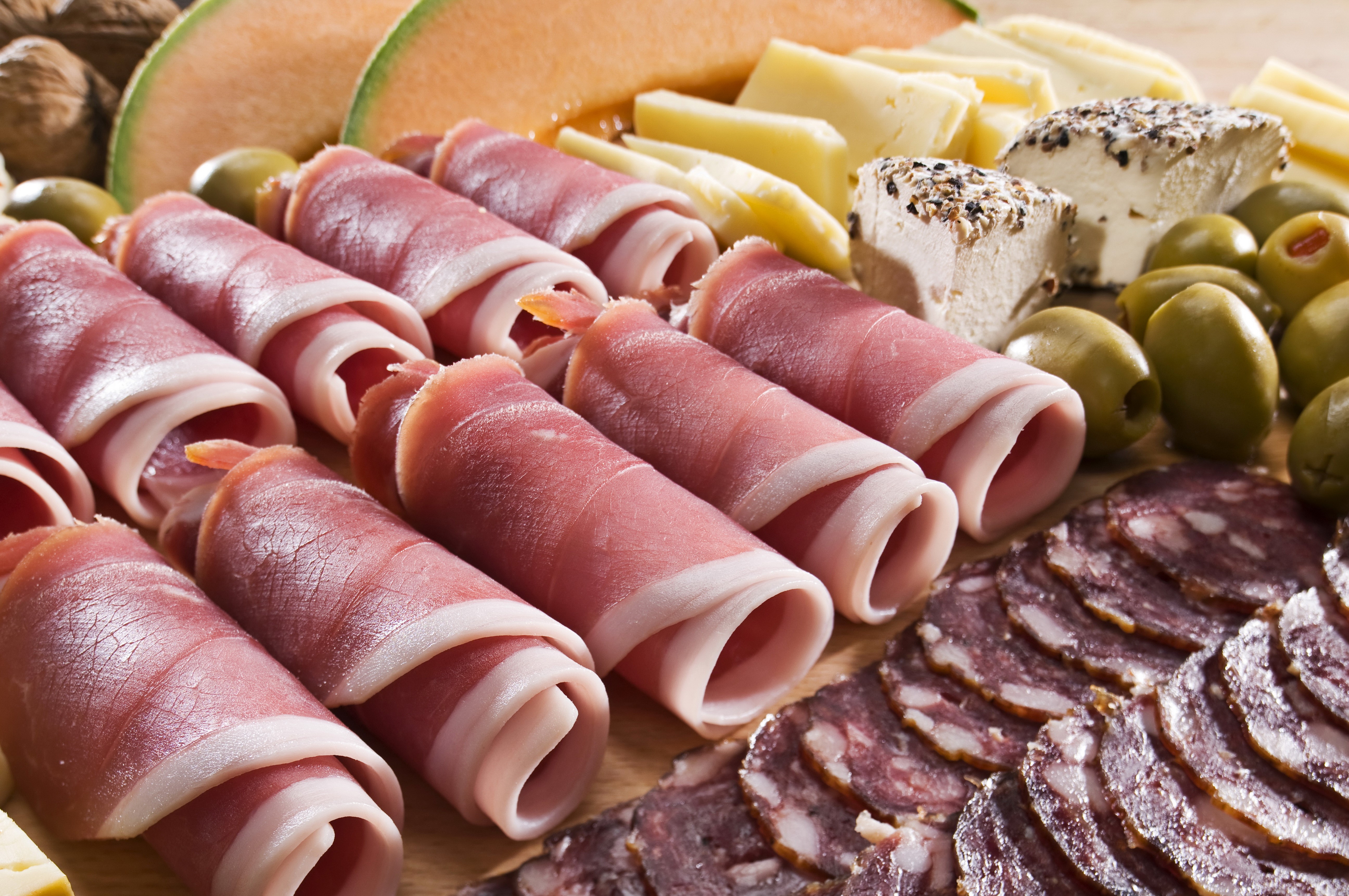 Meat products, ham, cheese, olives, and melon platter HD Wallpaper