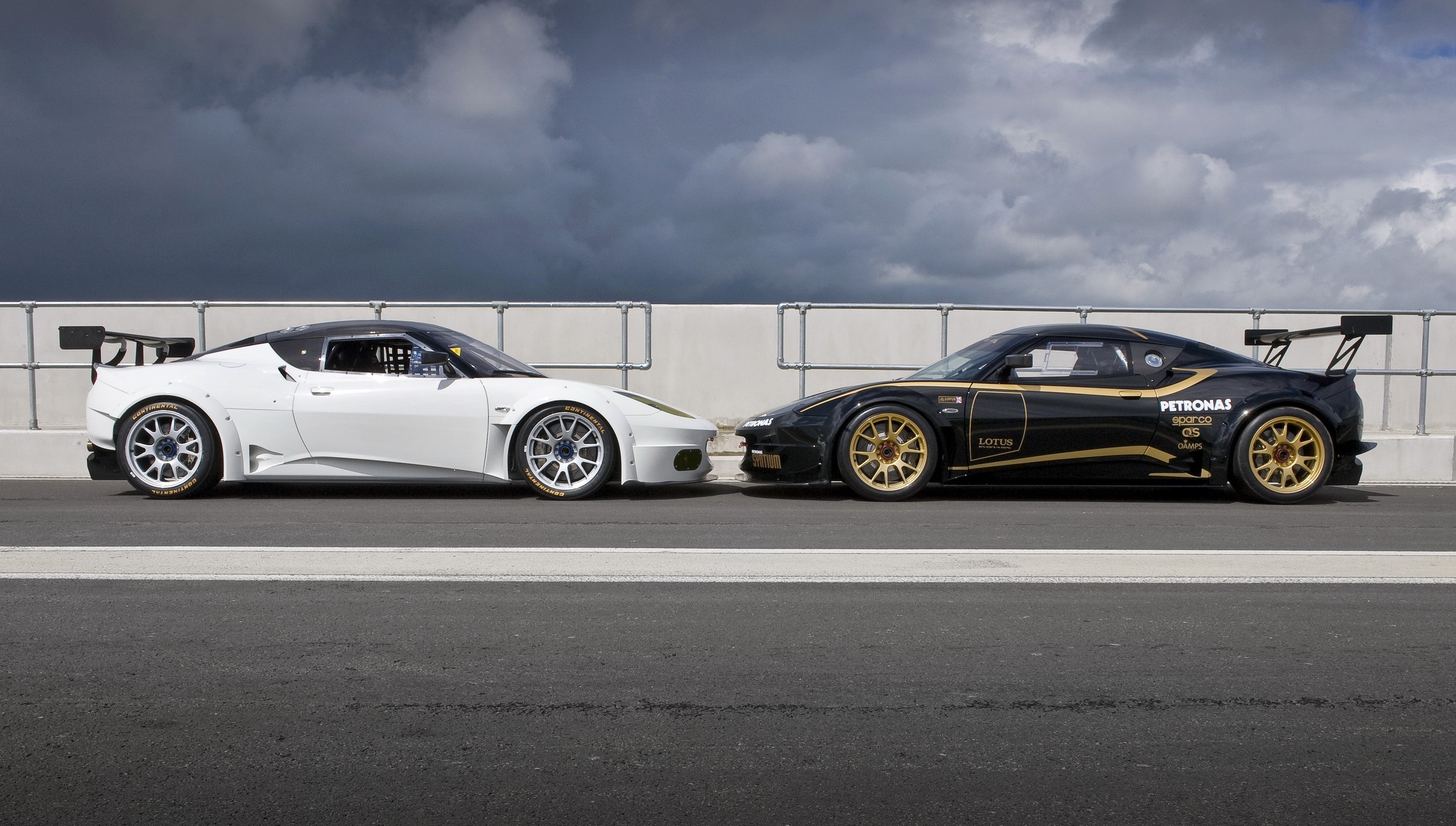 Lotus Evora GX race cars on asphalt HD Wallpaper