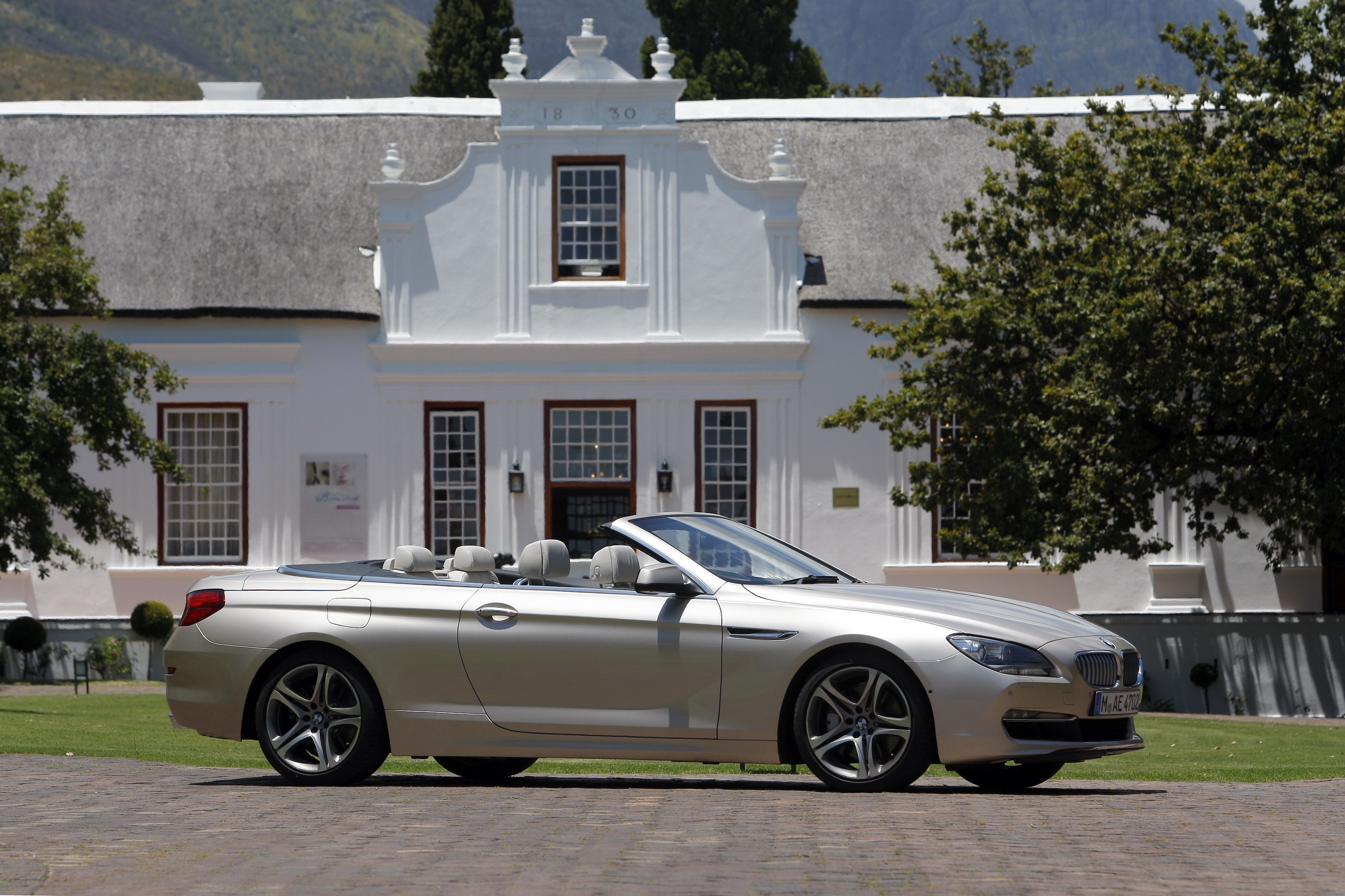 BMW 6 Series Convertible parked in front of a historic building HD Wallpaper