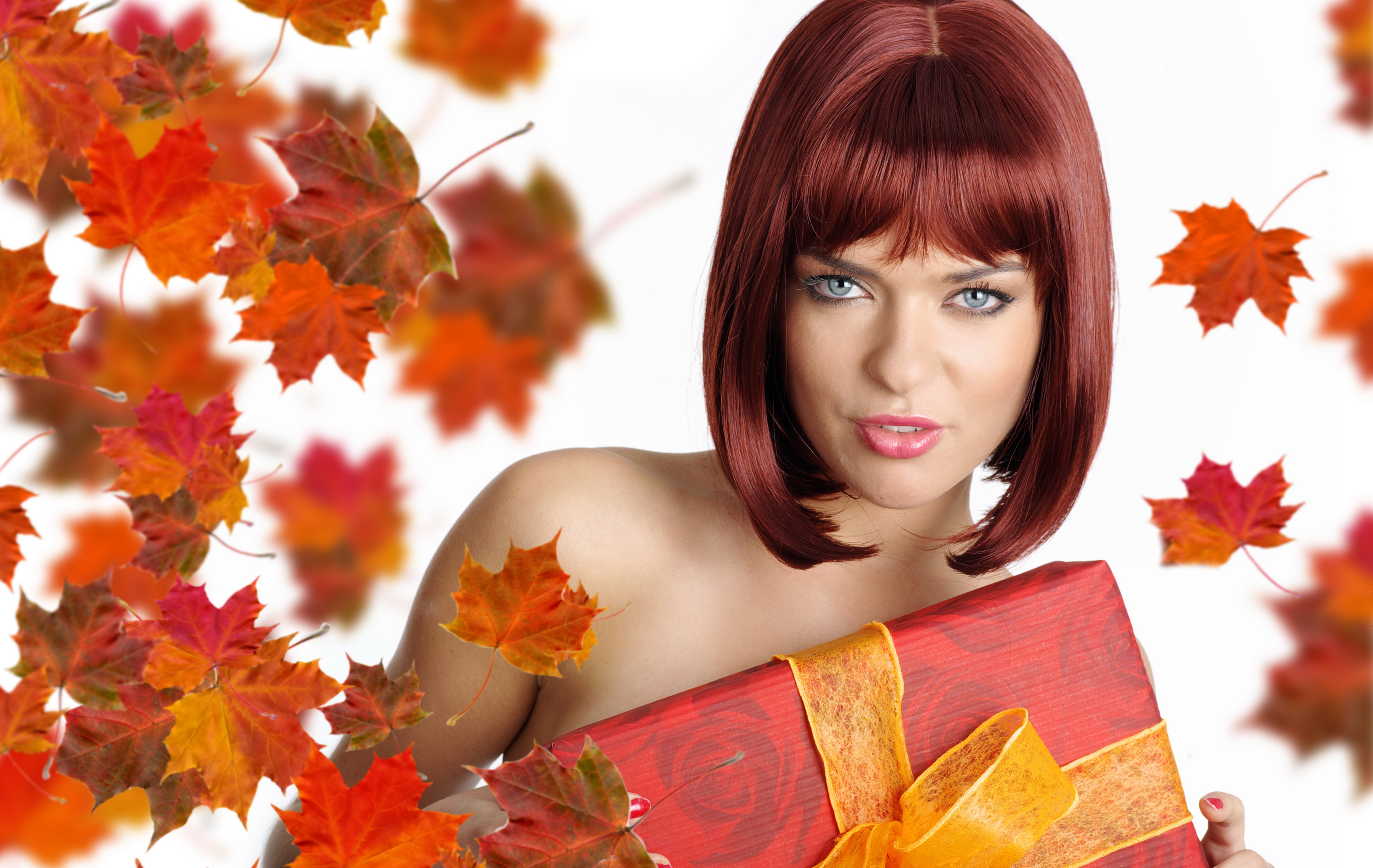 Woman with red hair holding a gift box with autumn leaves HD Wallpaper