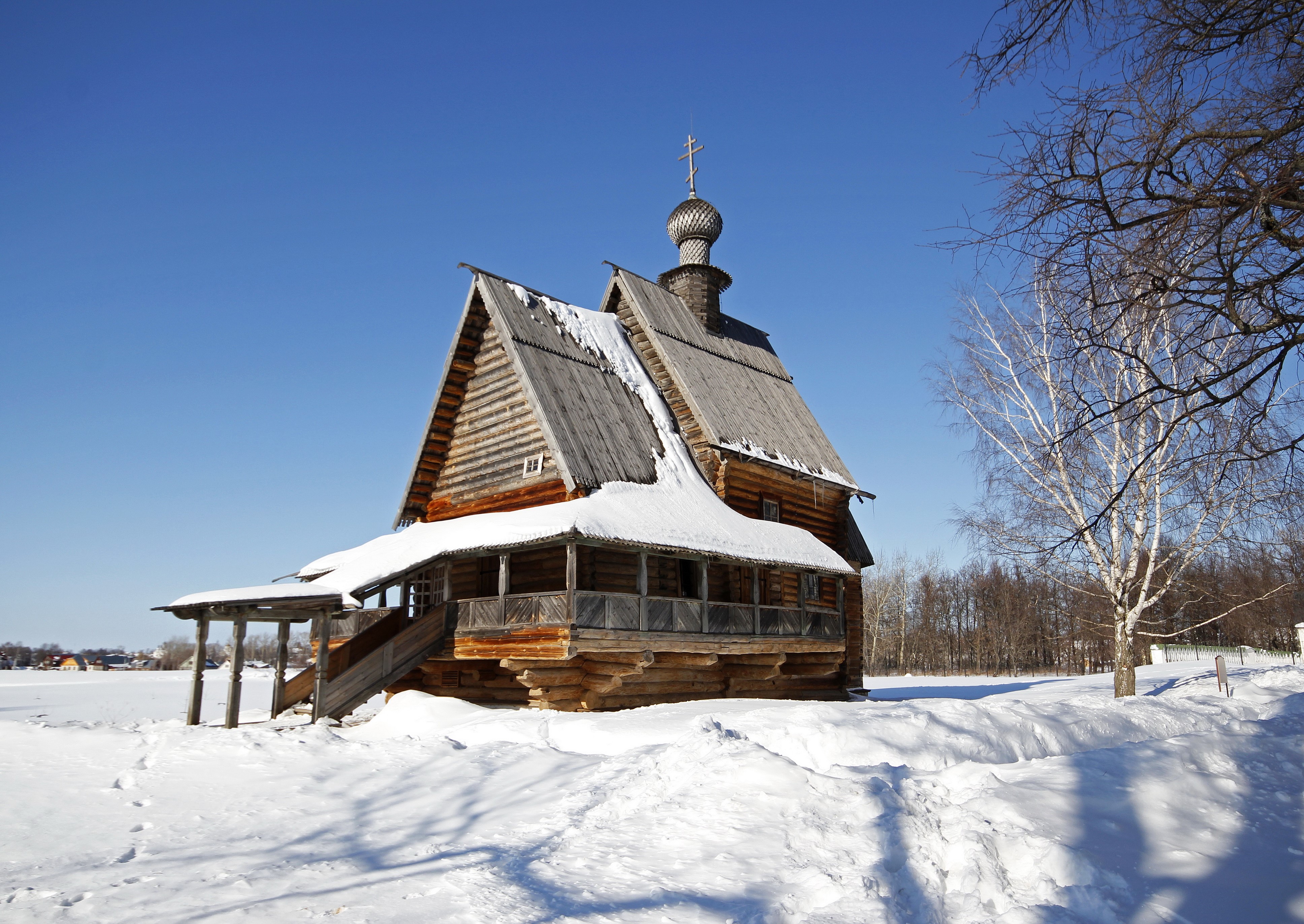 Wooden church in Russia during winter with snow HD Wallpaper