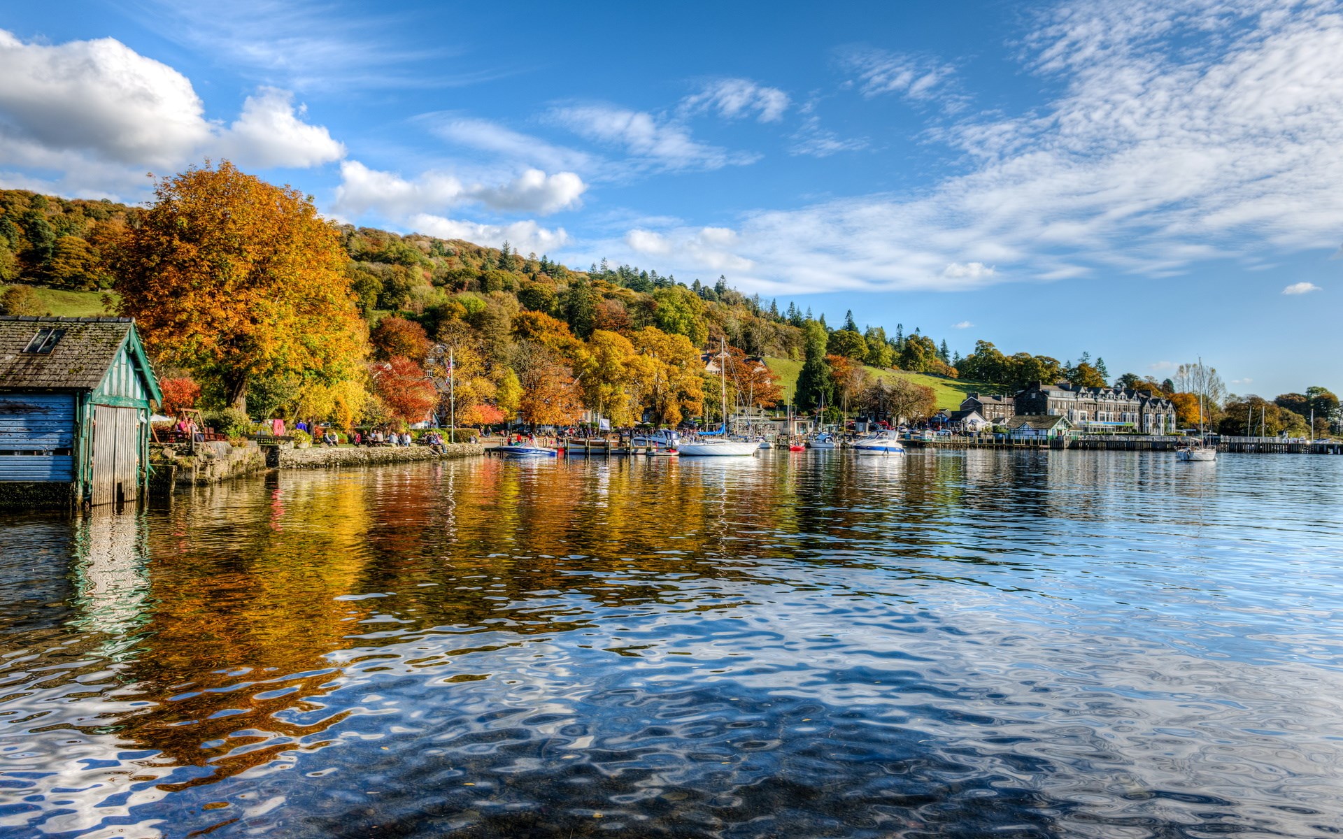Boathouse and boats on a lake in autumn HD Wallpaper