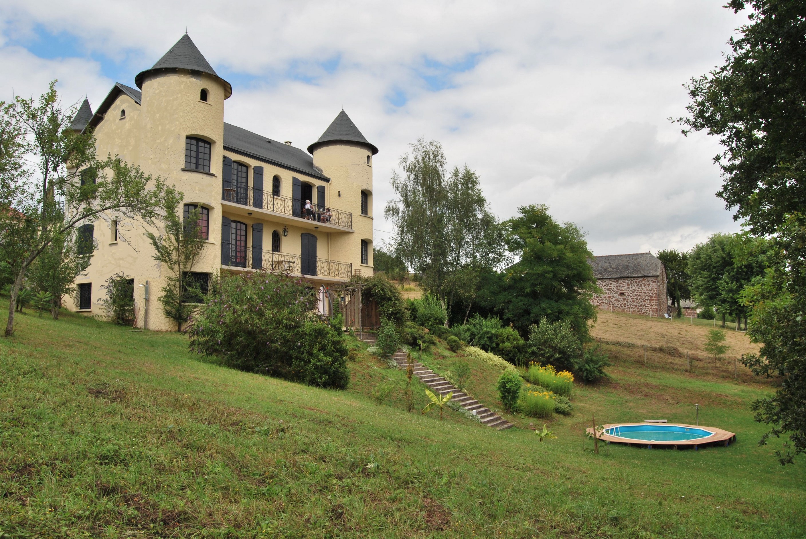 Yellow castle-like house with a pool in France HD Wallpaper