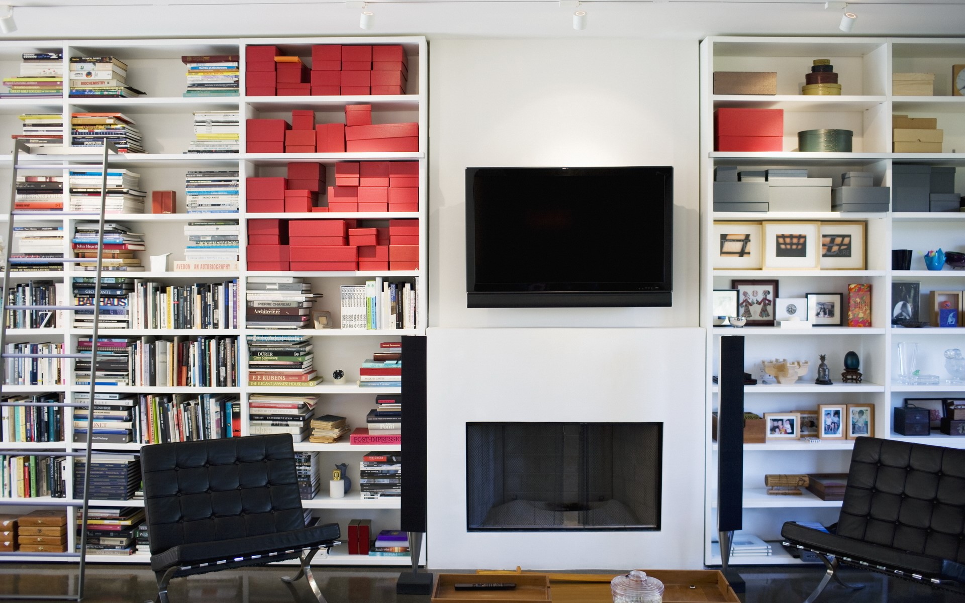 Living room with bookshelves and fireplace HD Wallpaper