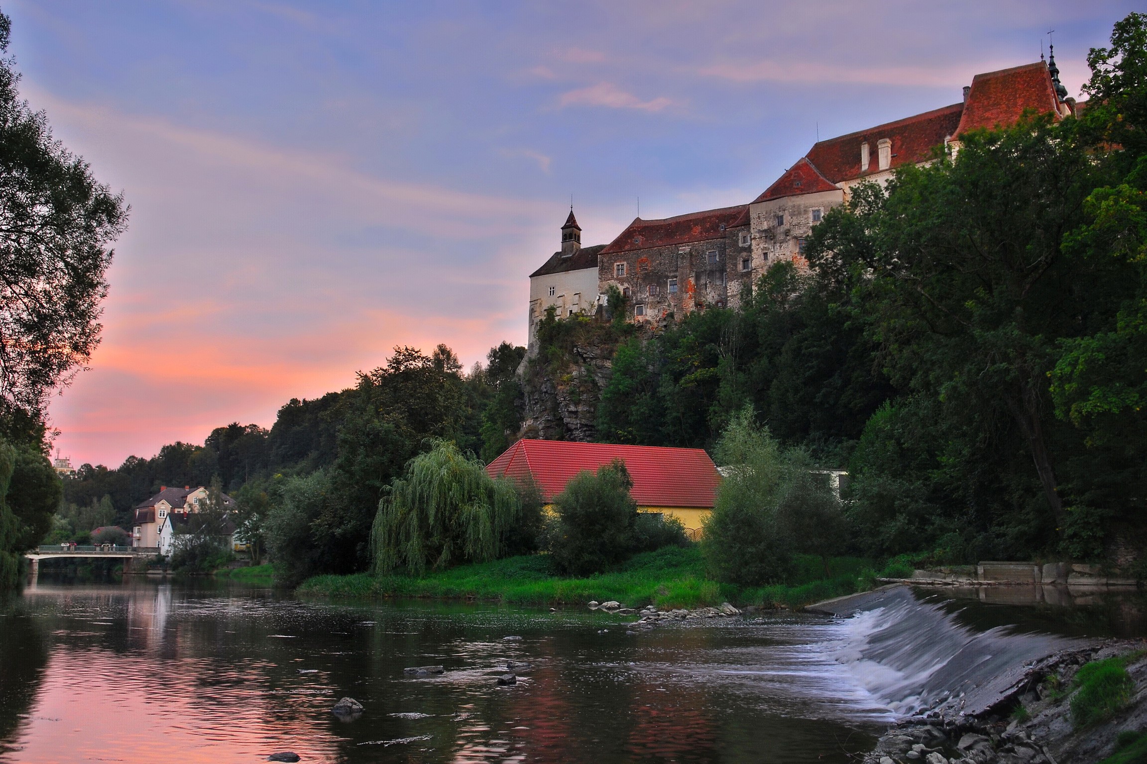 Castle above a river at sunset in Raabs, Austria HD Wallpaper