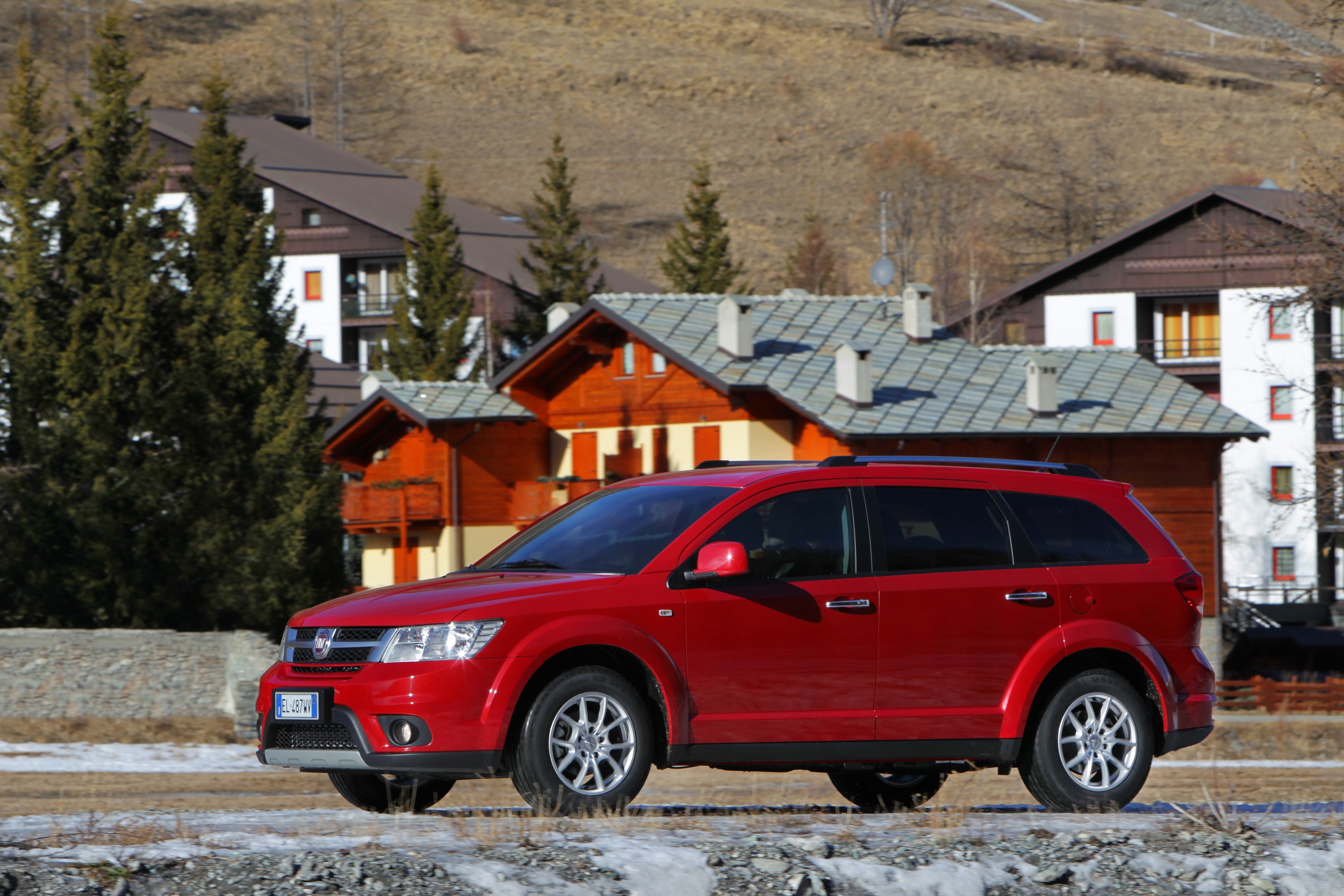 Red Fiat Freemont AWD parked in a mountain village HD Wallpaper