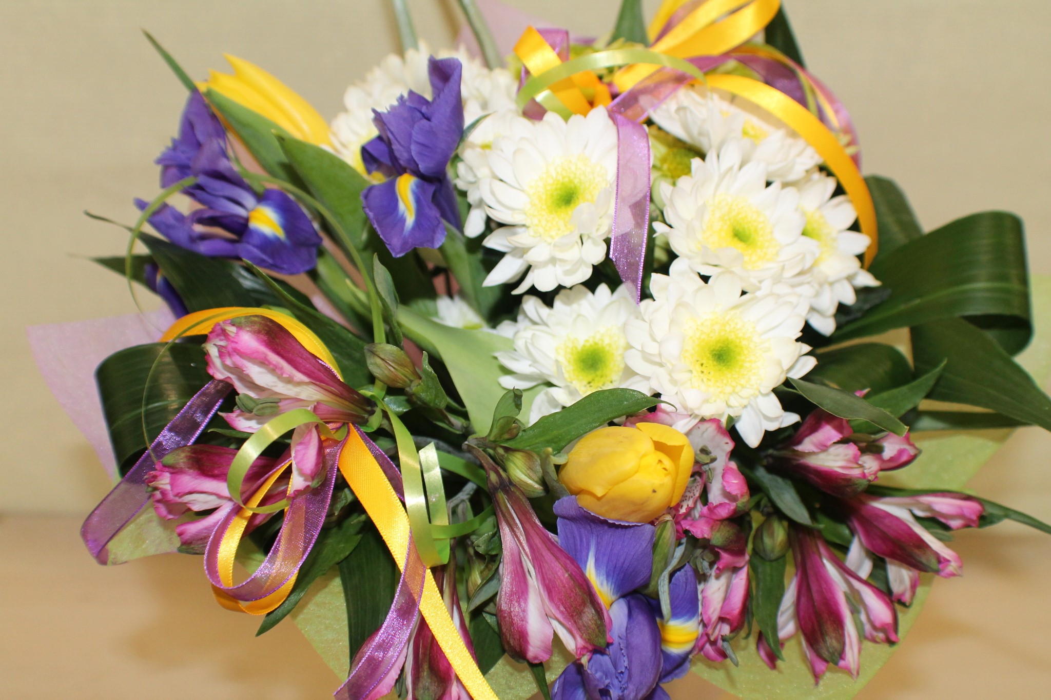 Bouquet of flowers with tulips, irises, and daisies HD Wallpaper