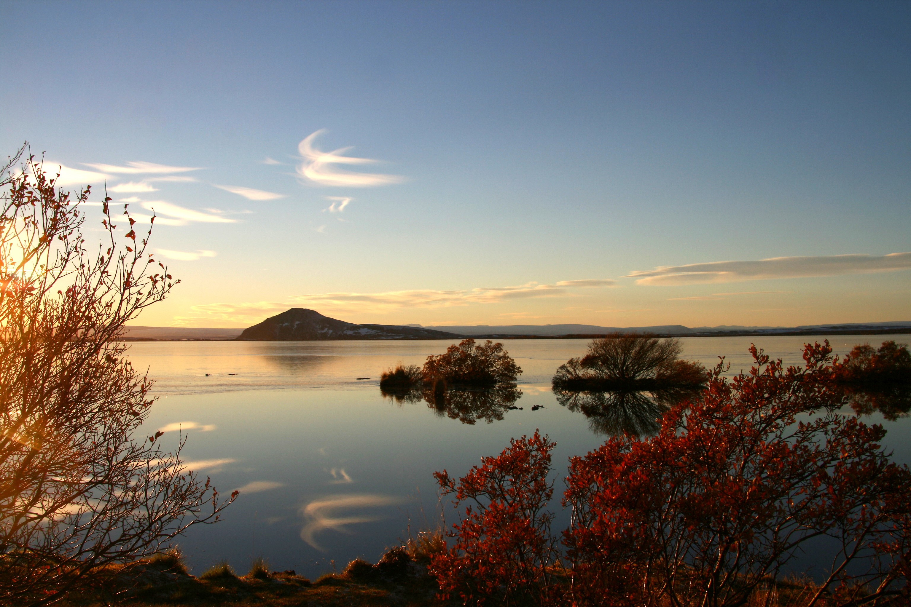 Lake Myvatn, Iceland at sunset with a mountain in the distance HD Wallpaper
