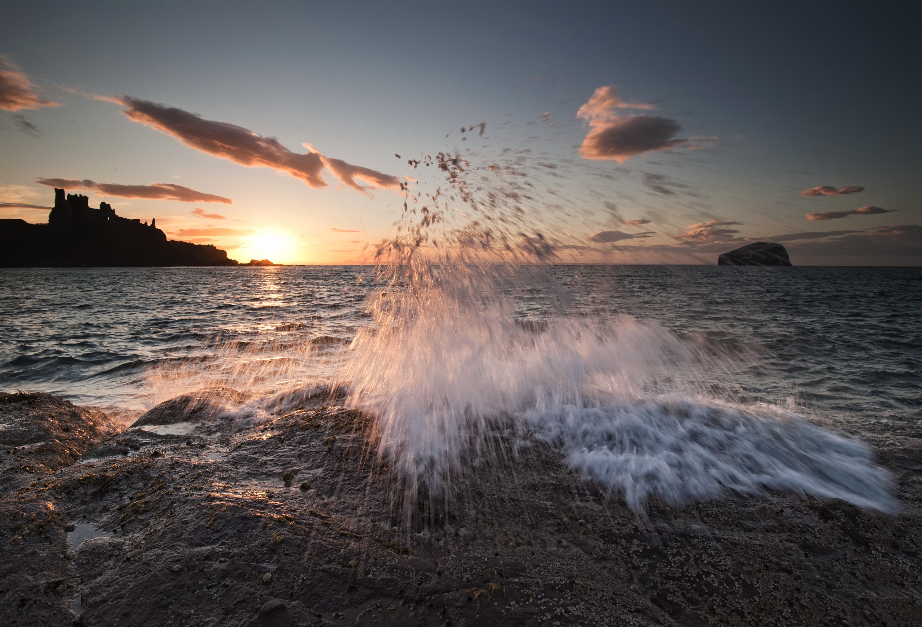 Sunset waves crashing on rocks near Edinburgh, Scotland HD Wallpaper