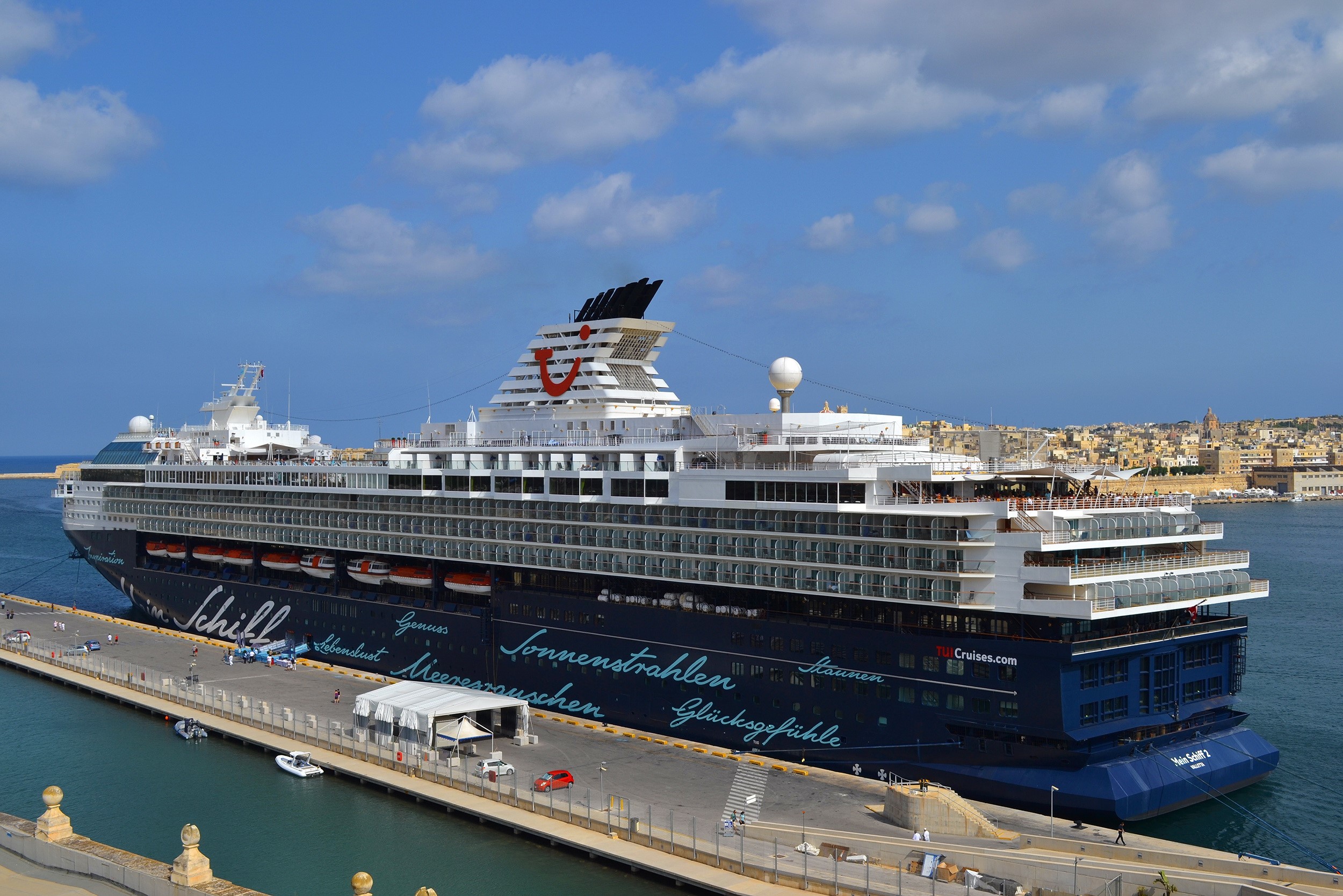 Mein Schiff cruise liner docked at a harbor HD Wallpaper