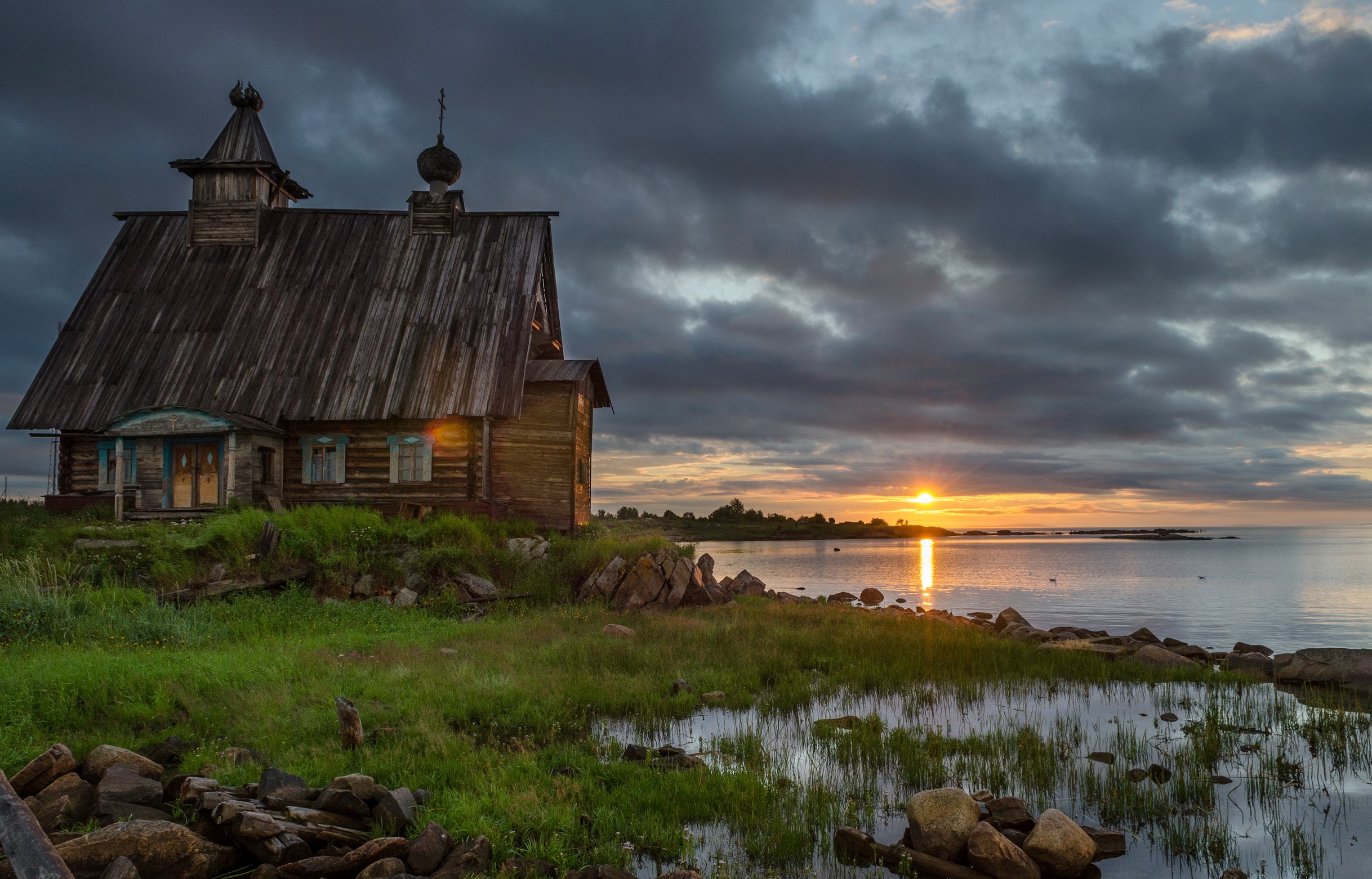 Wooden church by the sea at sunset HD Wallpaper