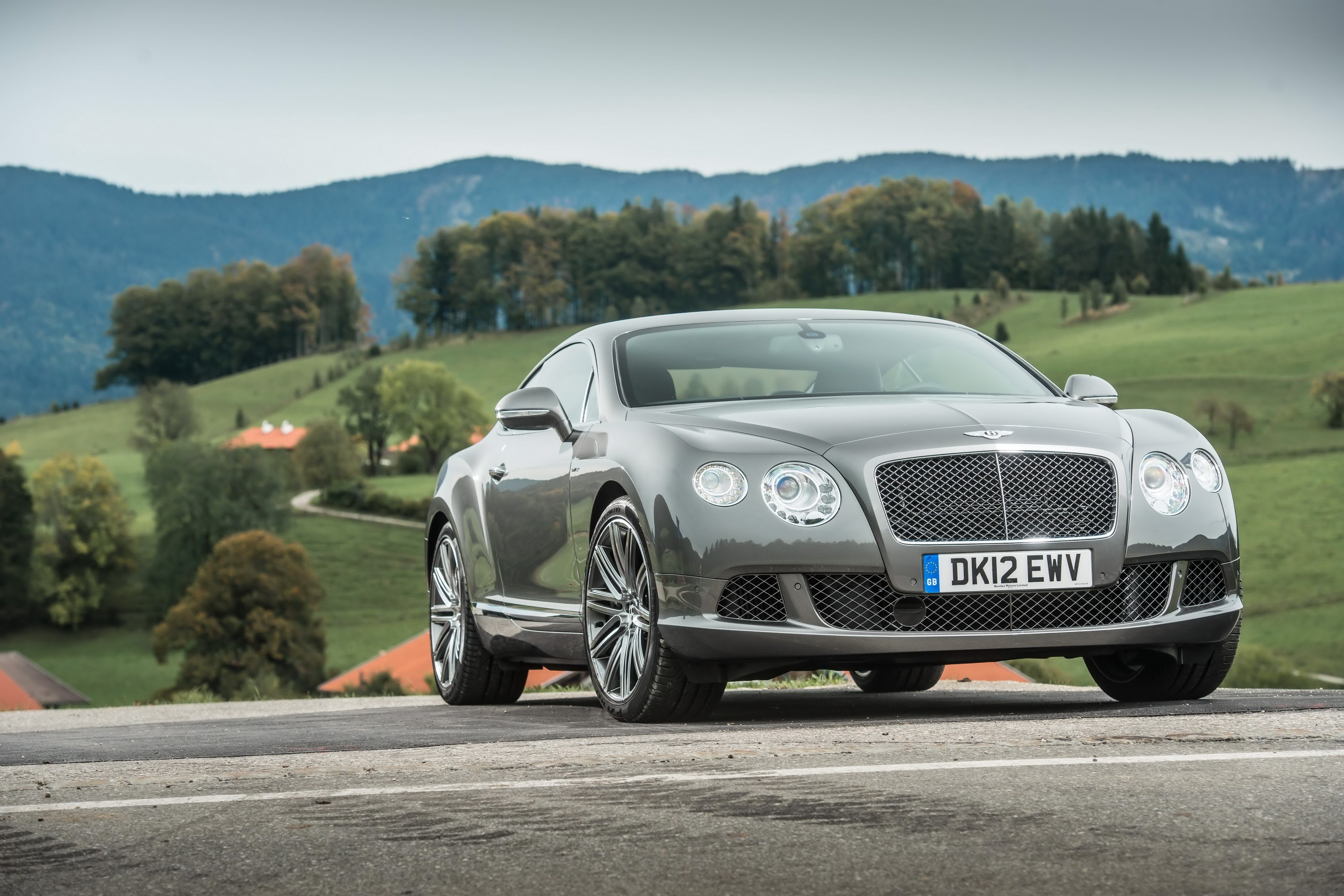Bentley Continental GT Speed on a scenic road HD Wallpaper