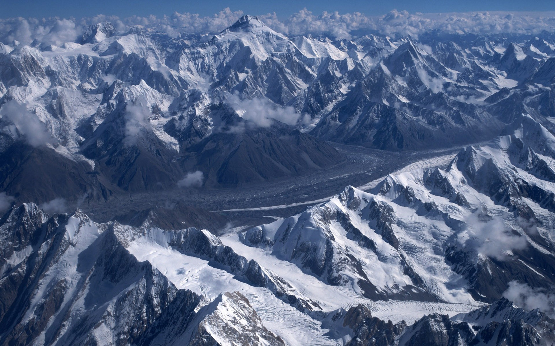 Snow-covered mountains and glaciers under a blue sky HD Wallpaper