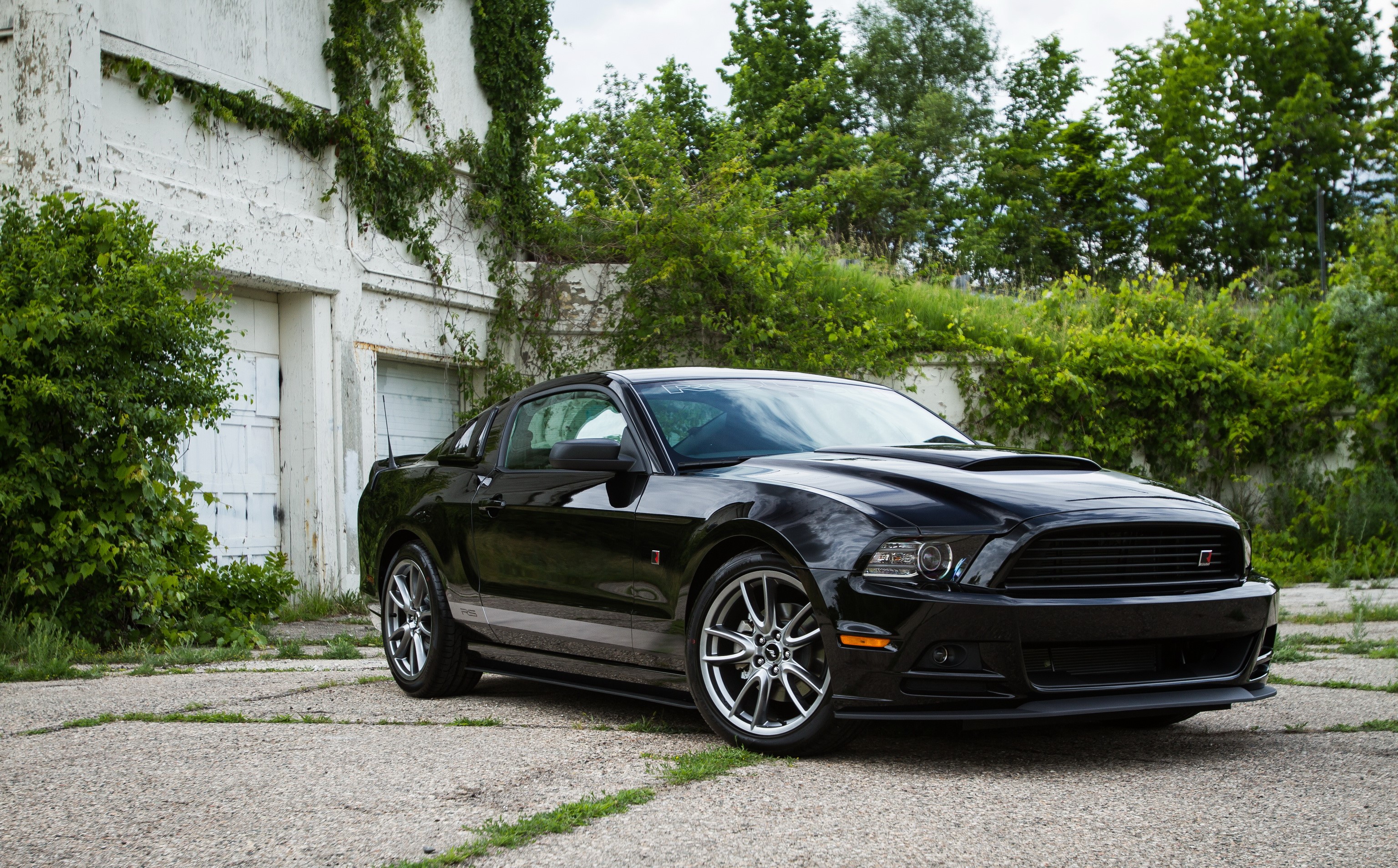 Black 2012 Ford Mustang RS parked outdoors HD Wallpaper