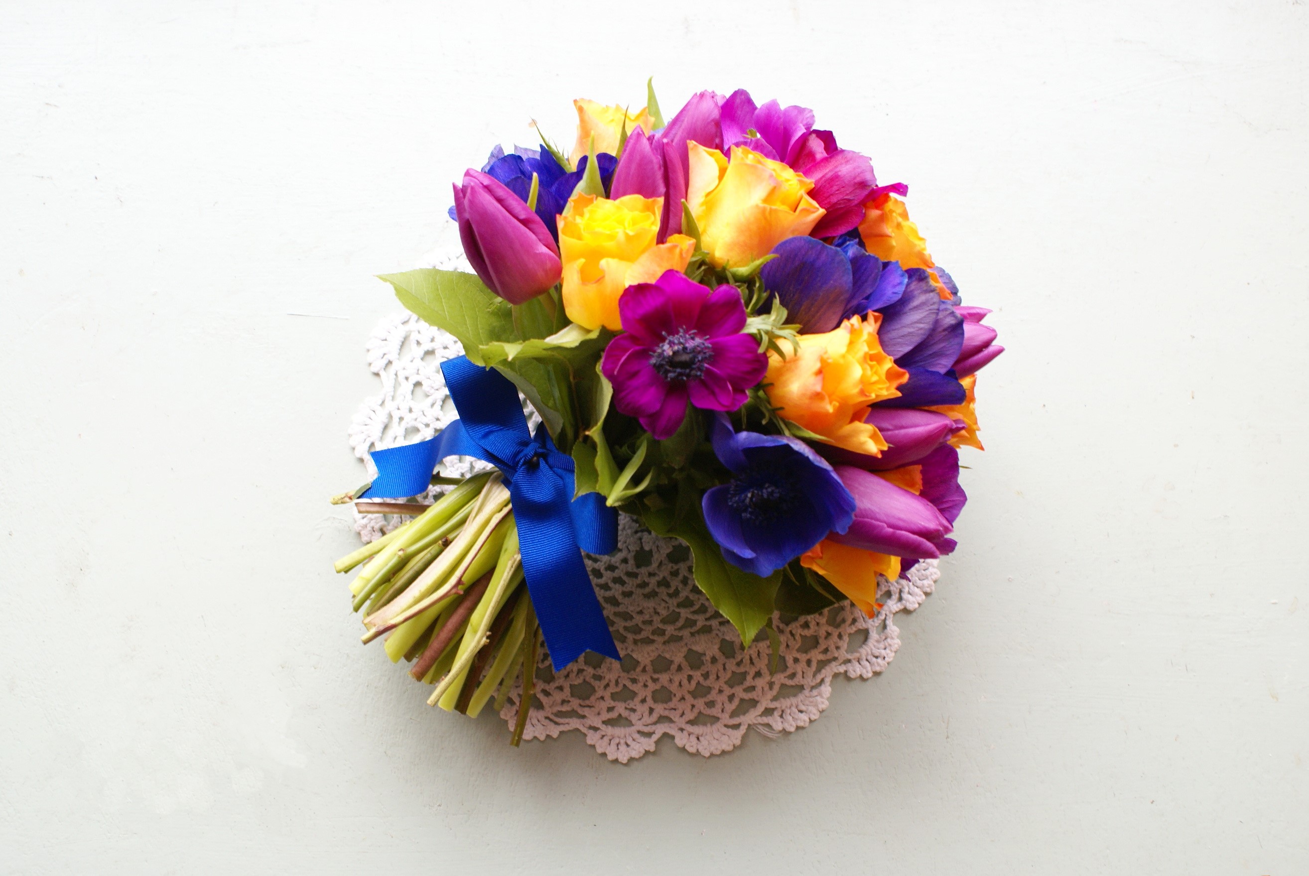 Colorful bouquet of tulips and roses with a blue ribbon HD Wallpaper