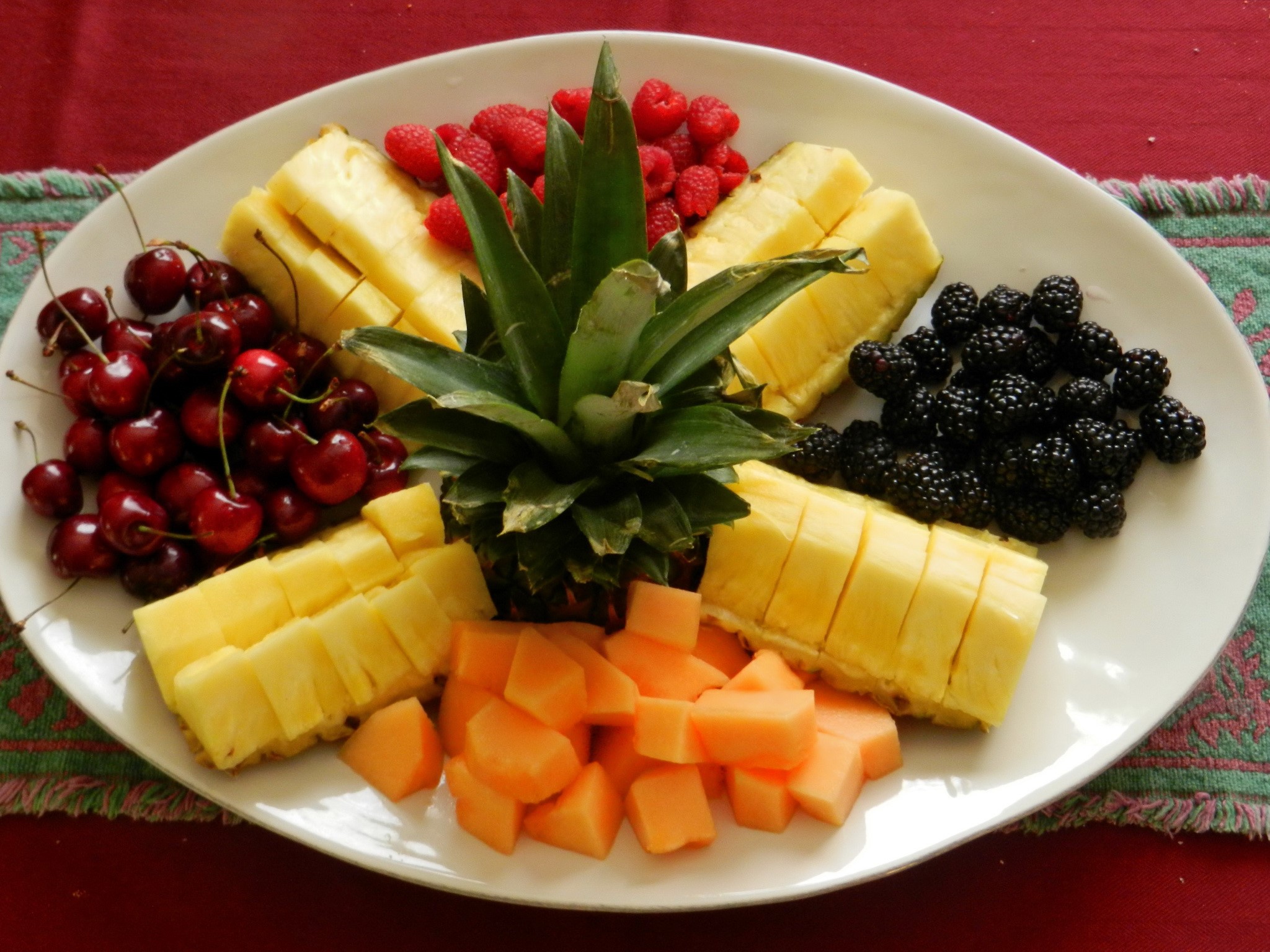 Fruit platter with pineapple, cherries, raspberries, blackberries, and cantaloupe HD Wallpaper