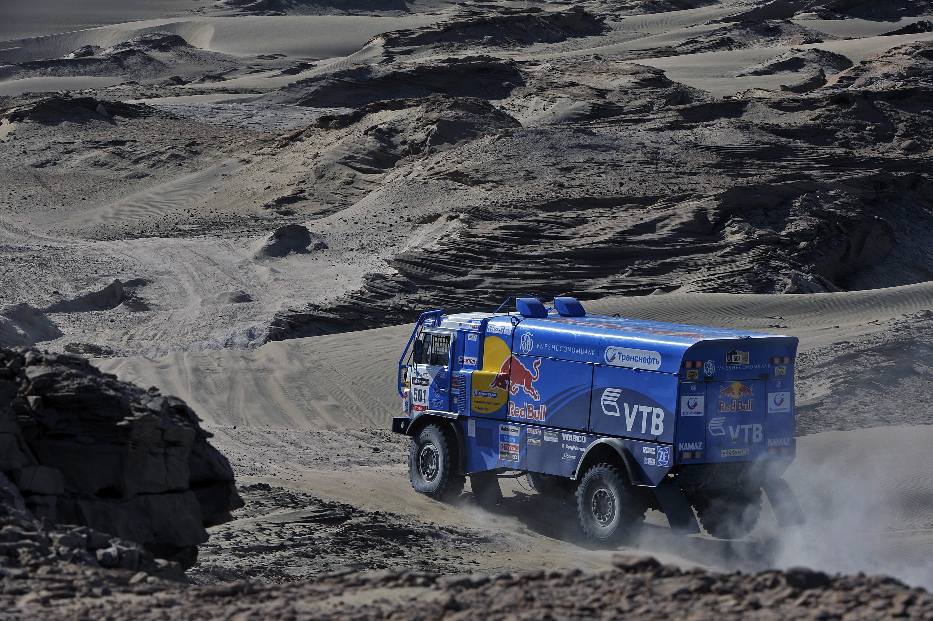 KAMAZ truck racing in a desert landscape HD Wallpaper