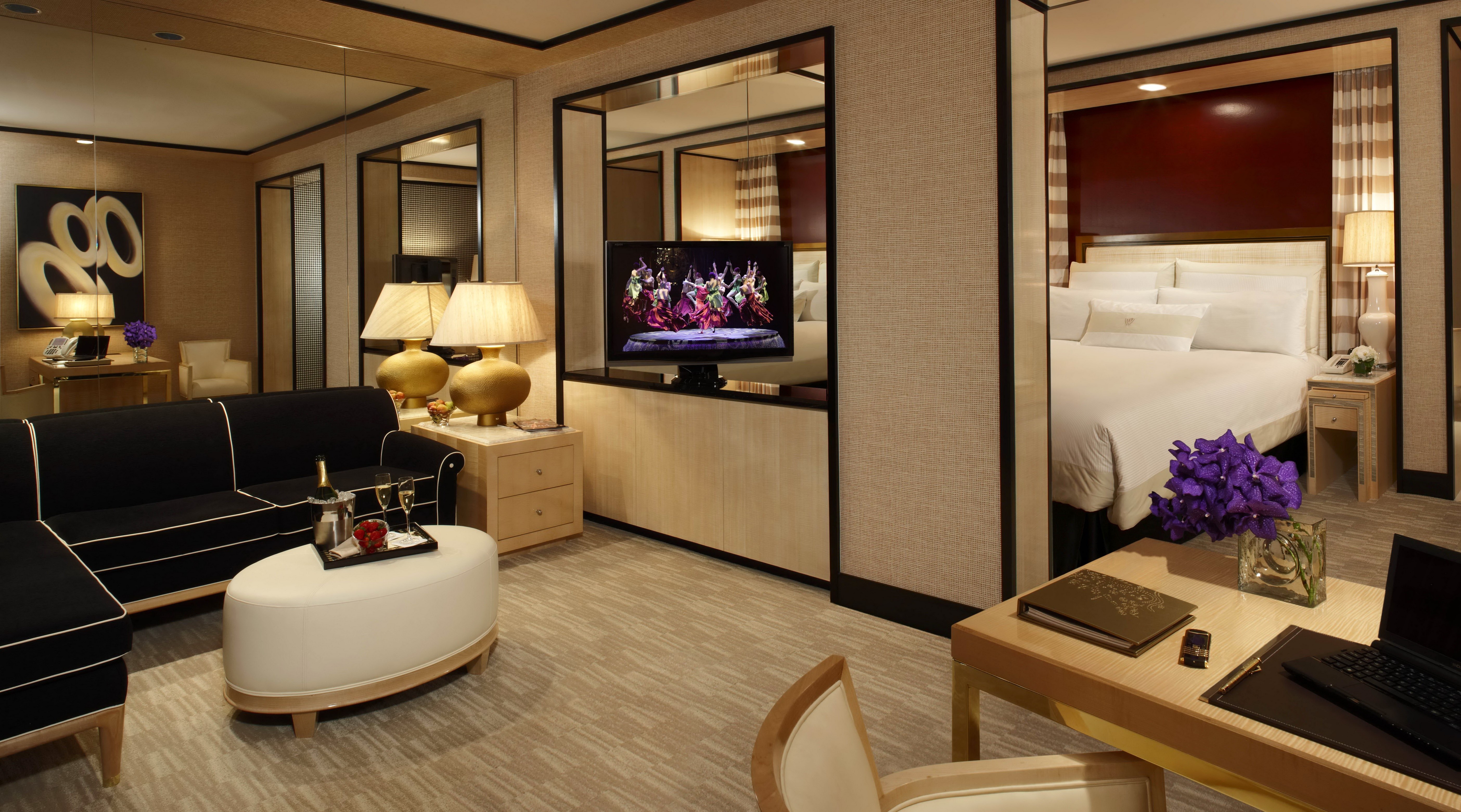 Luxury hotel suite with living area and bedroom HD Wallpaper