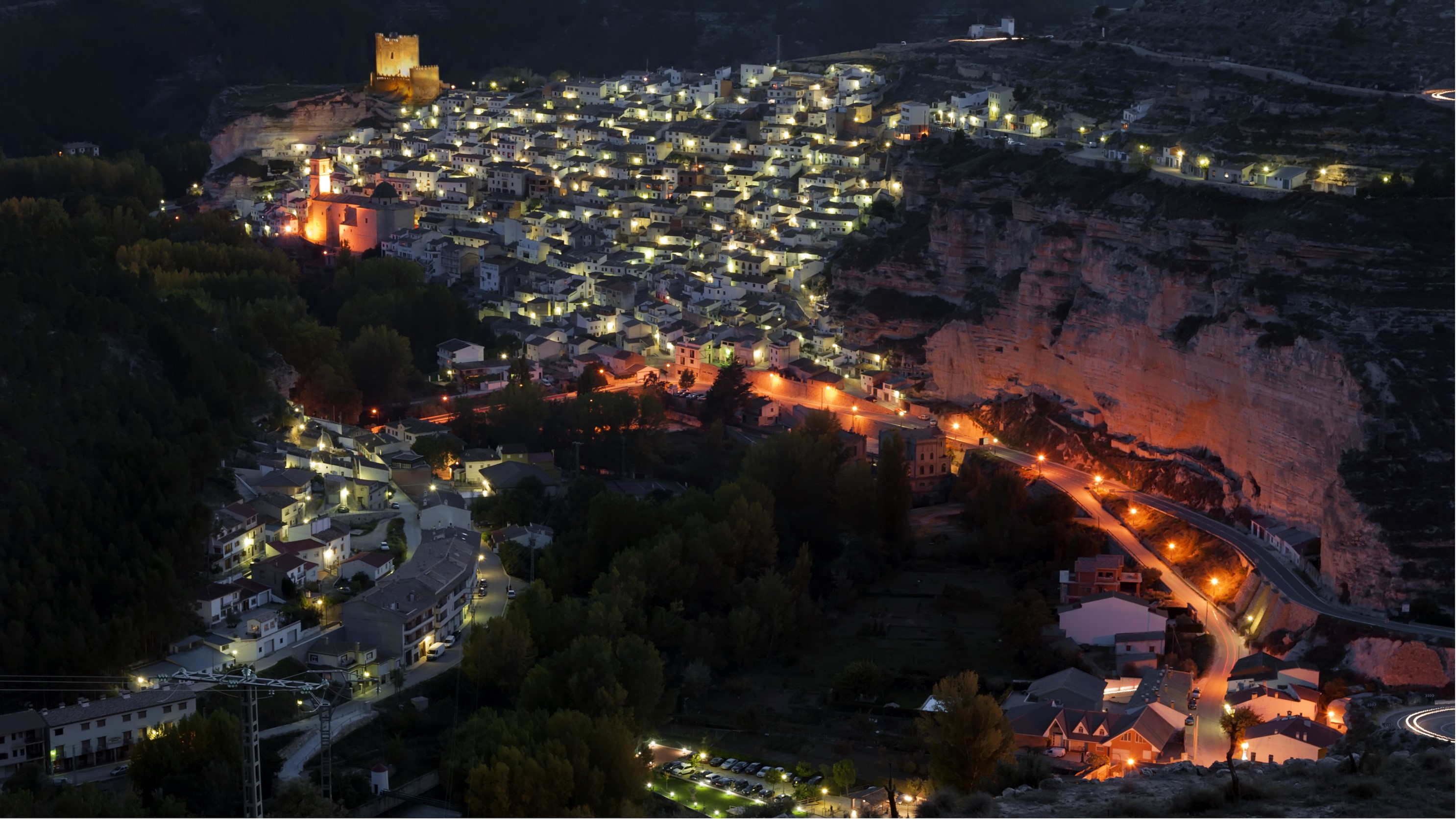 Night view of a town on a cliff in Albacete, Spain HD Wallpaper