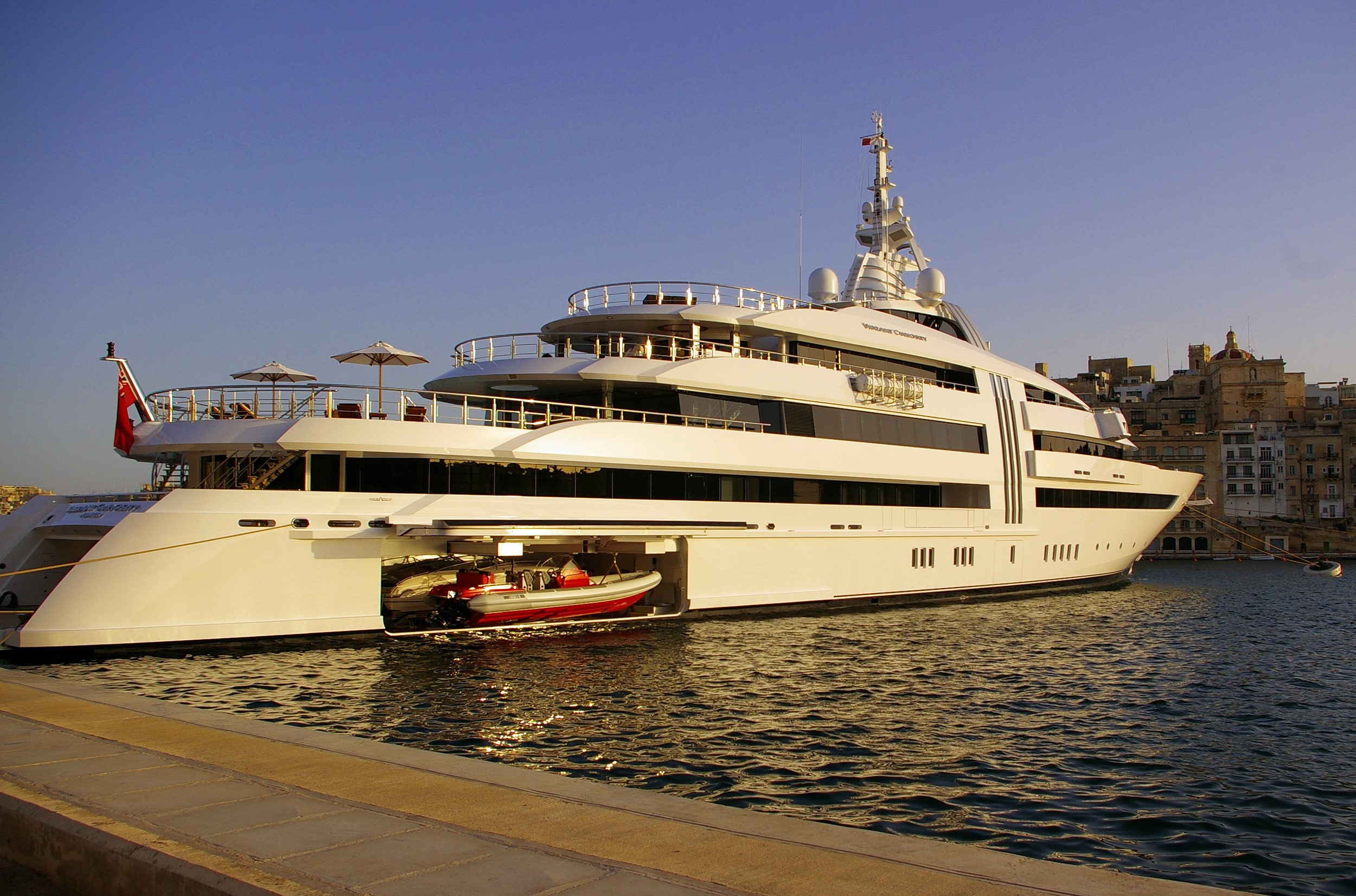 Superyacht Vibrant Curiosity docked in harbor HD Wallpaper