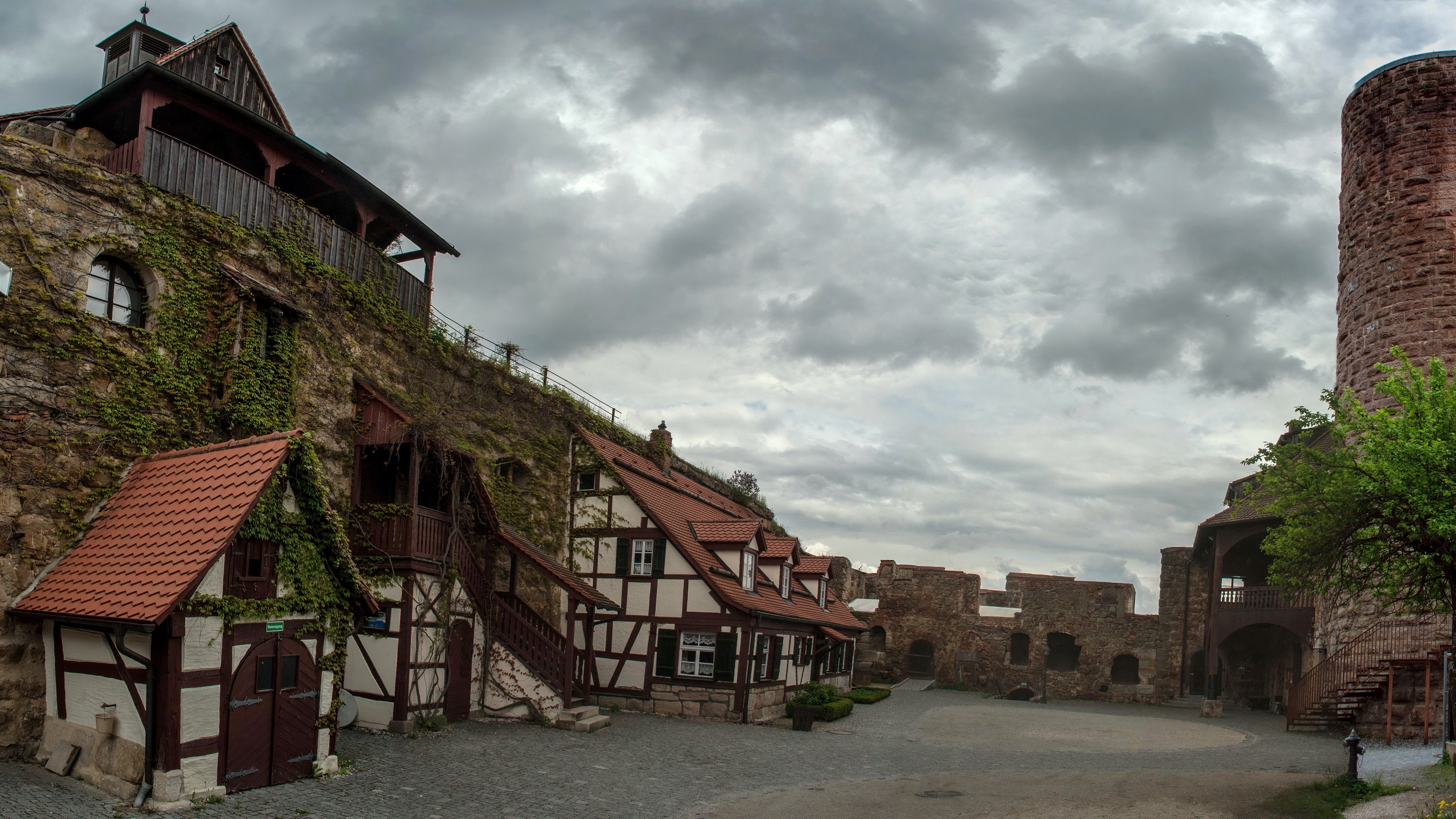 Burg Thann Castle Courtyard with Half-Timbered Buildings and Tower HD Wallpaper