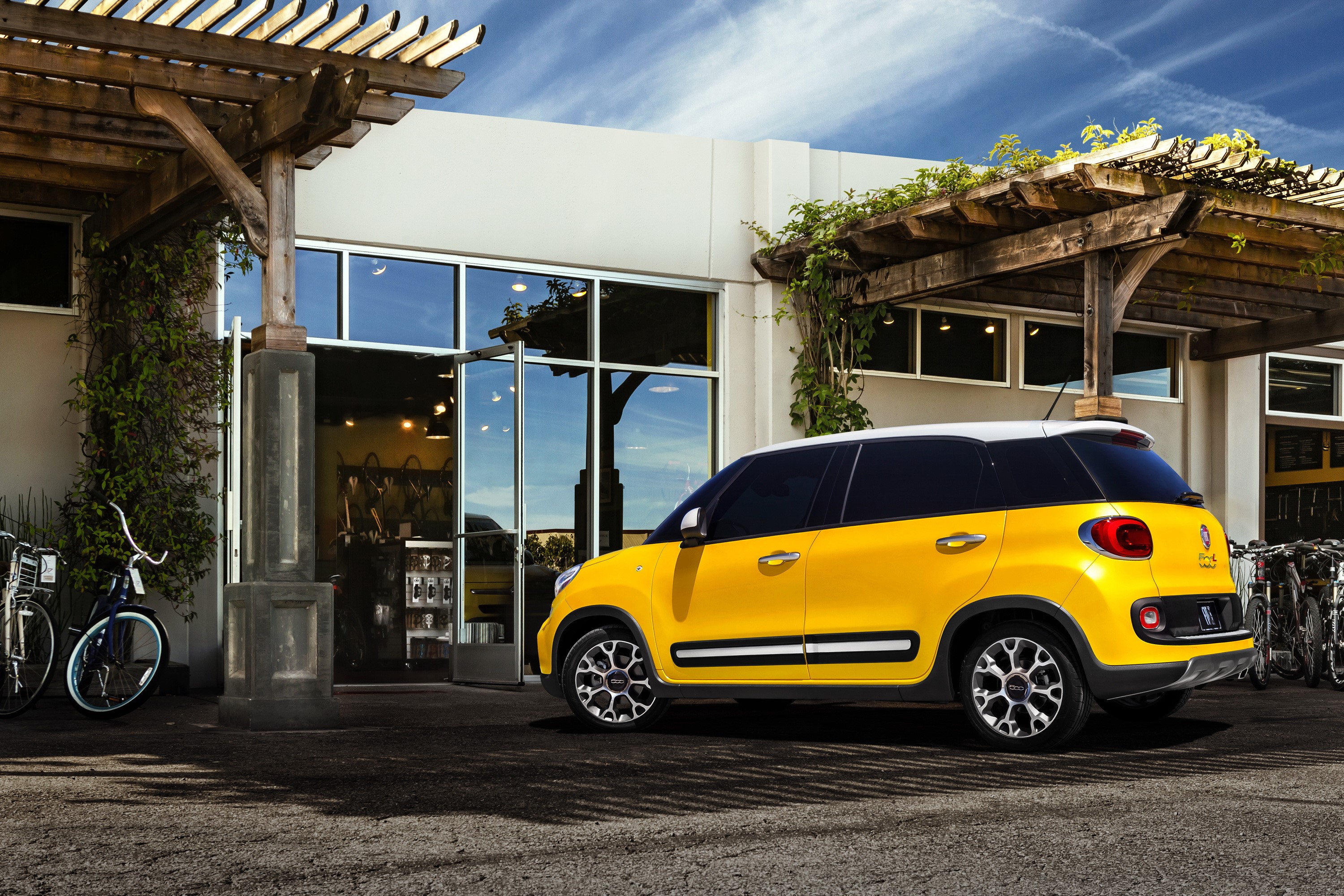 Yellow 2013 Fiat 500L Trekking parked outside building HD Wallpaper