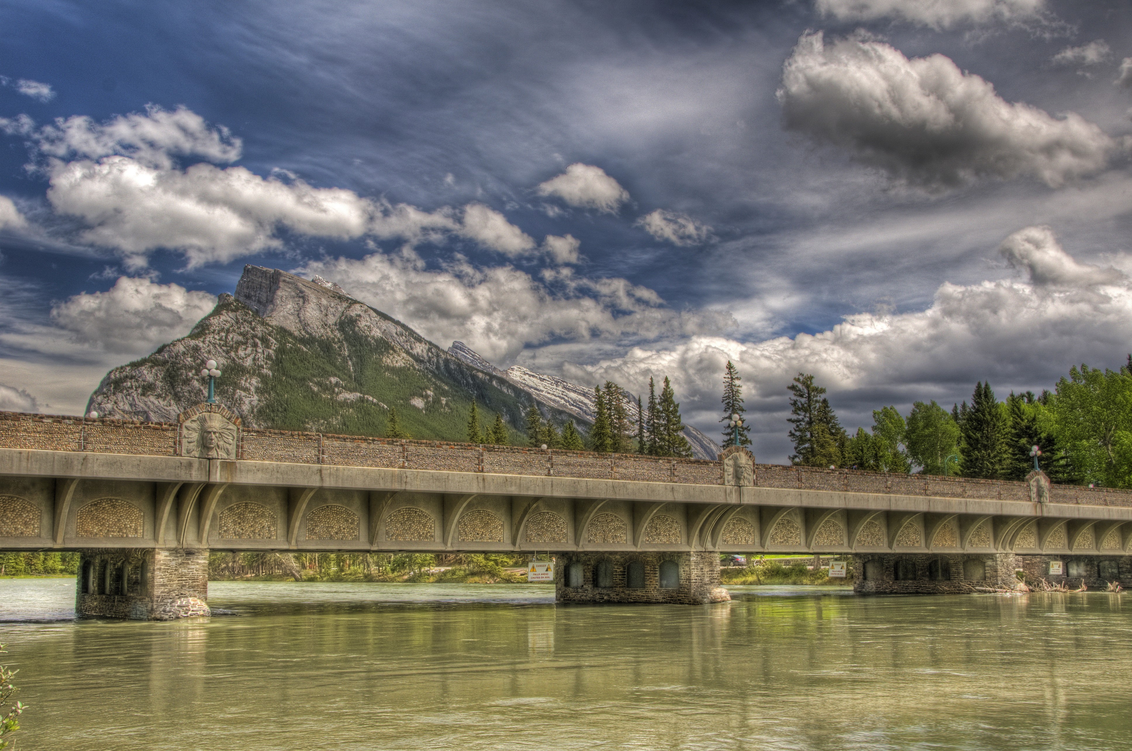 Bridge over river with mountain and clouds in Banff, Canada HD Wallpaper
