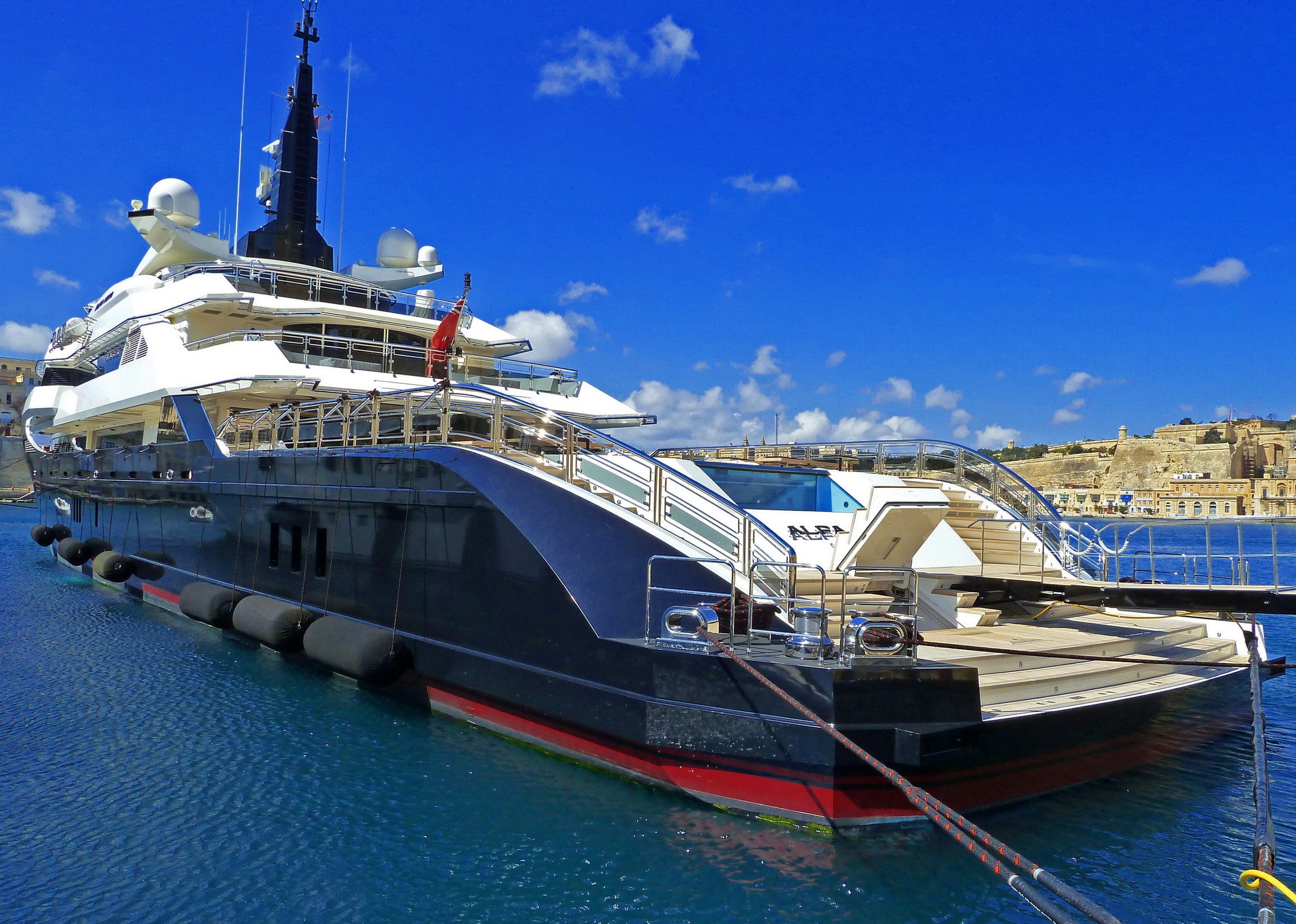 Superyacht Alfa Nero docked in a harbor HD Wallpaper