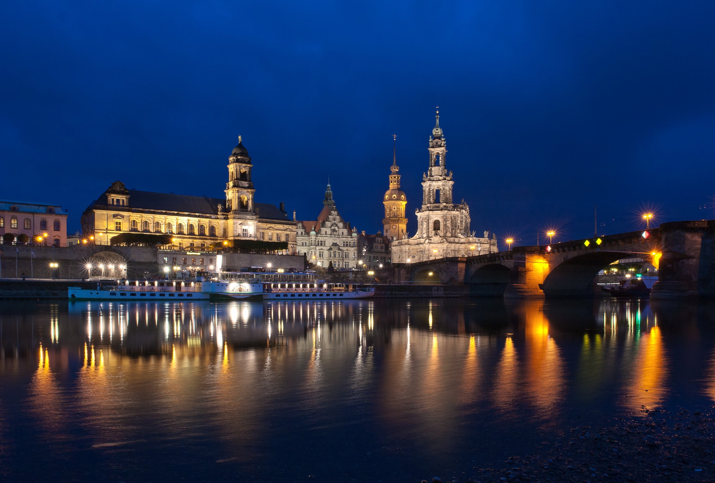 Dresden skyline at night with river and bridge HD Wallpaper