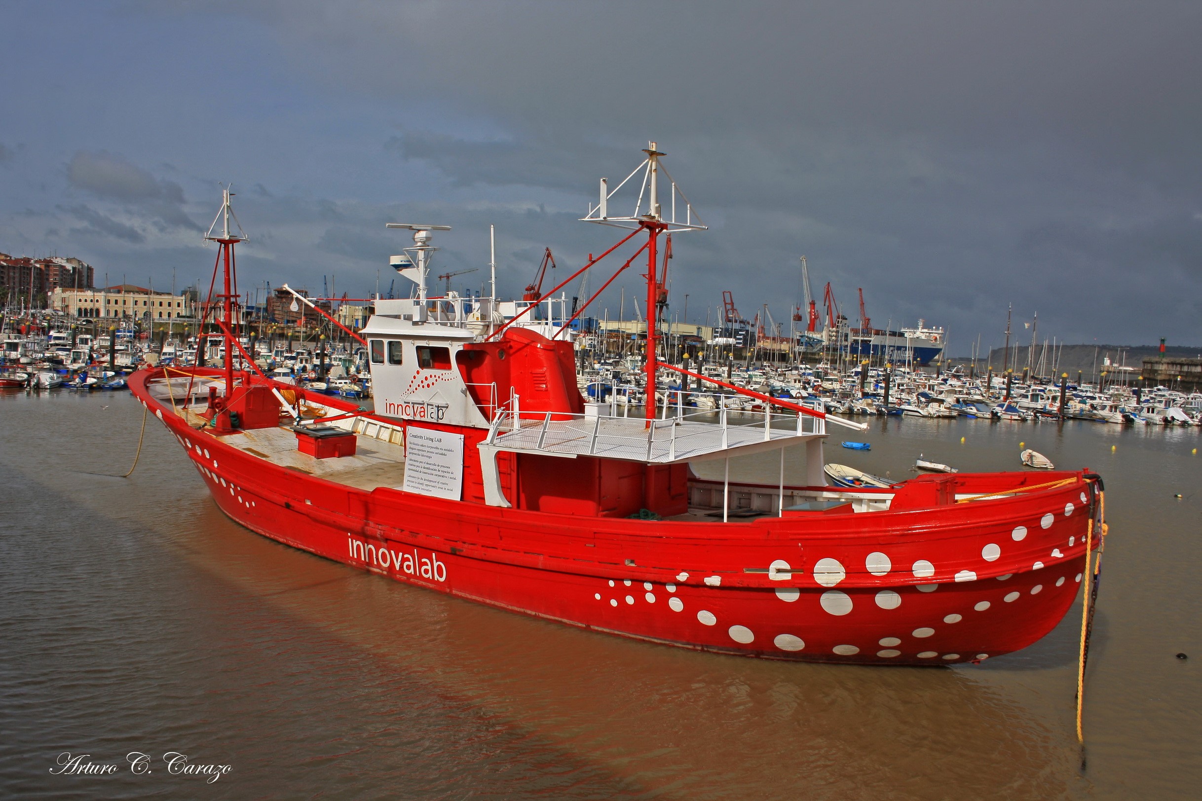 Red fishing boat with white polka dots in Bilbao harbor HD Wallpaper