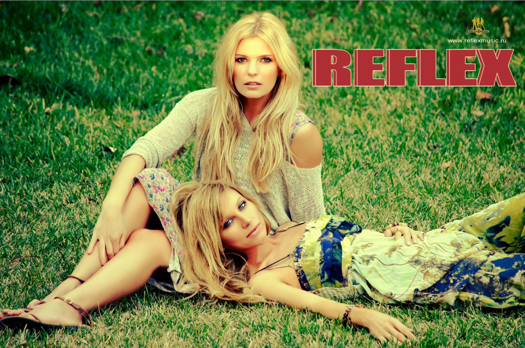Reflex band members Irene Nelson and another woman on grass HD Wallpaper