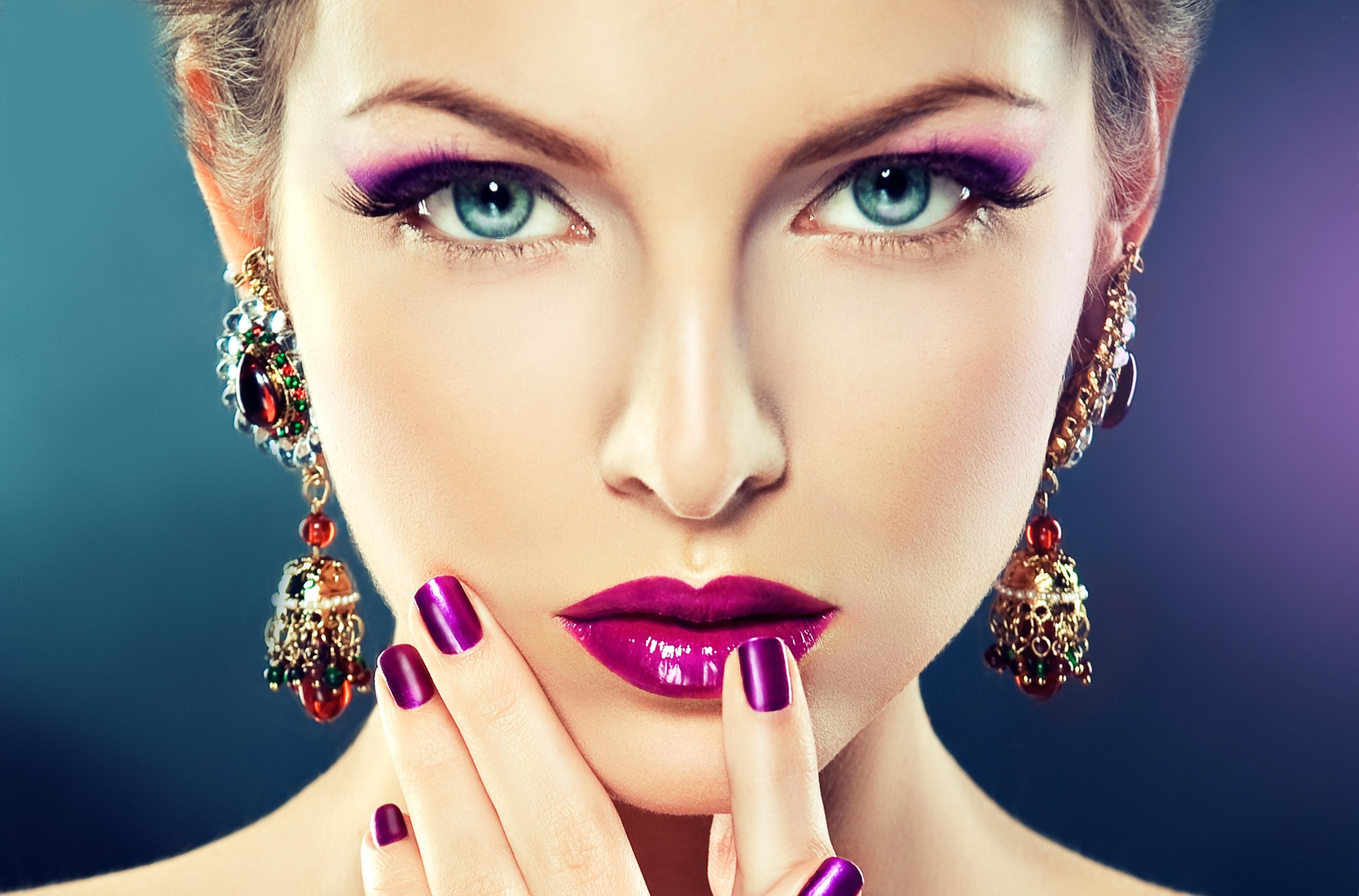 Woman with purple makeup and ornate earrings HD Wallpaper