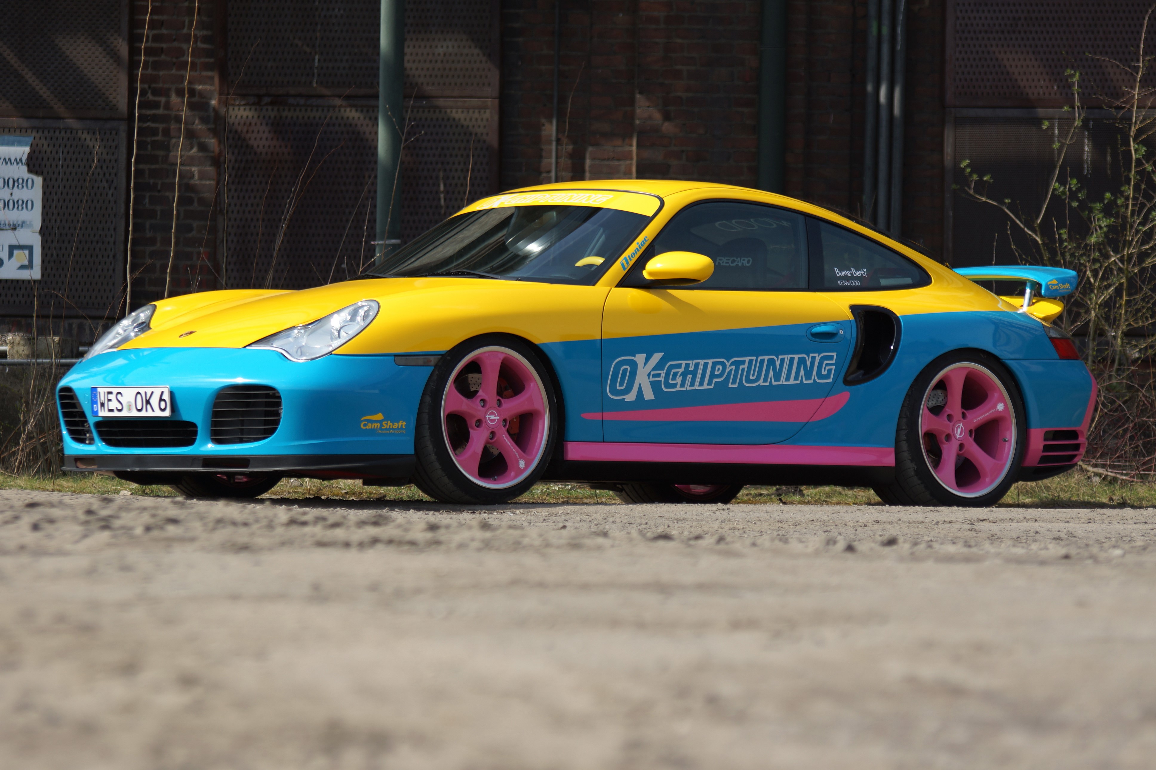 Yellow and blue Porsche 911 with pink wheels HD Wallpaper