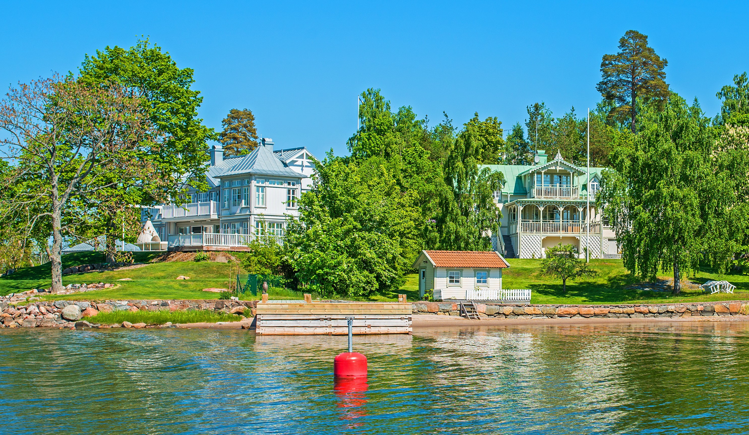 Vaxholm, Sweden waterfront with houses and trees HD Wallpaper