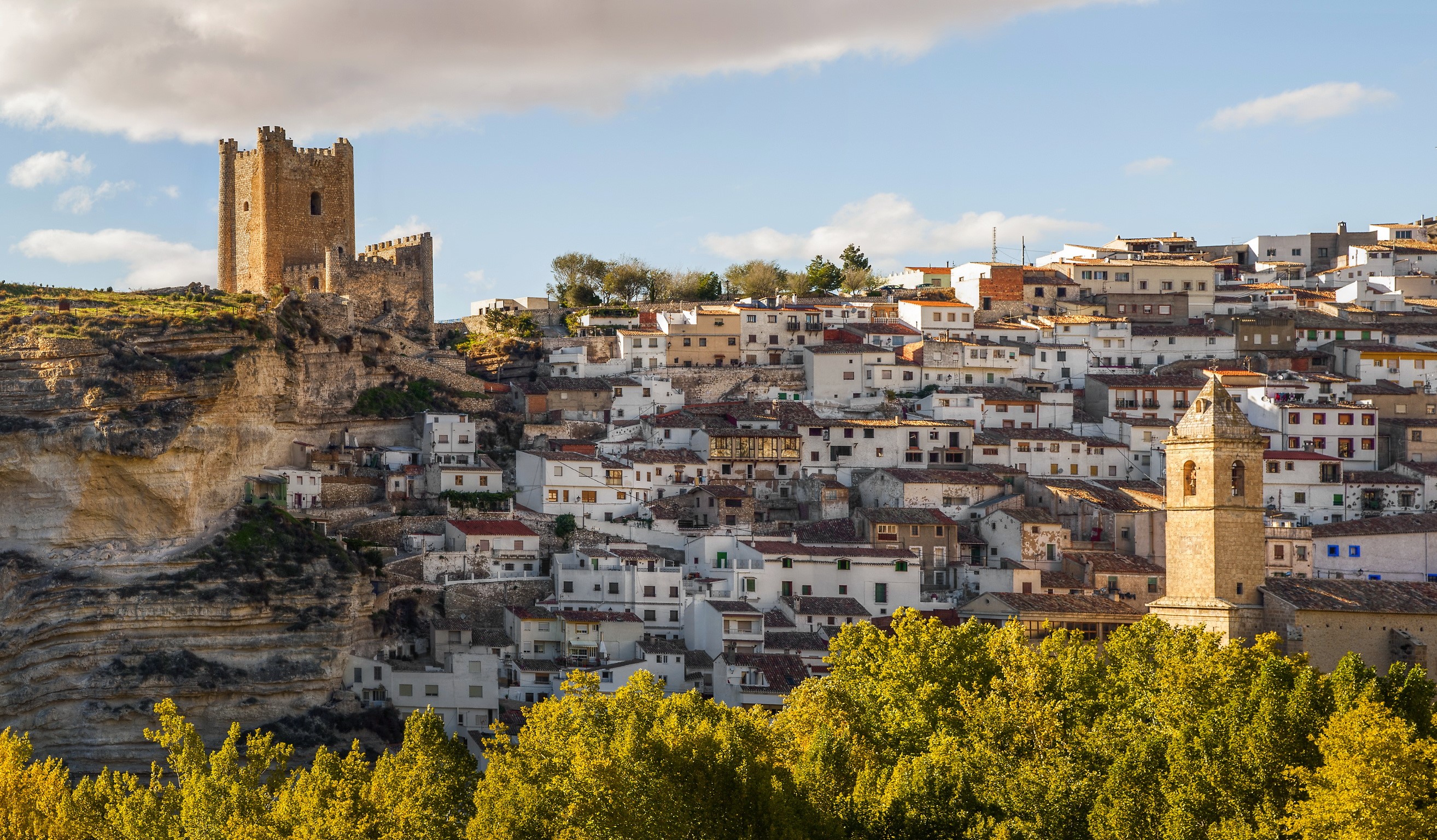 Castle and town on a cliffside in Albacete, Spain HD Wallpaper