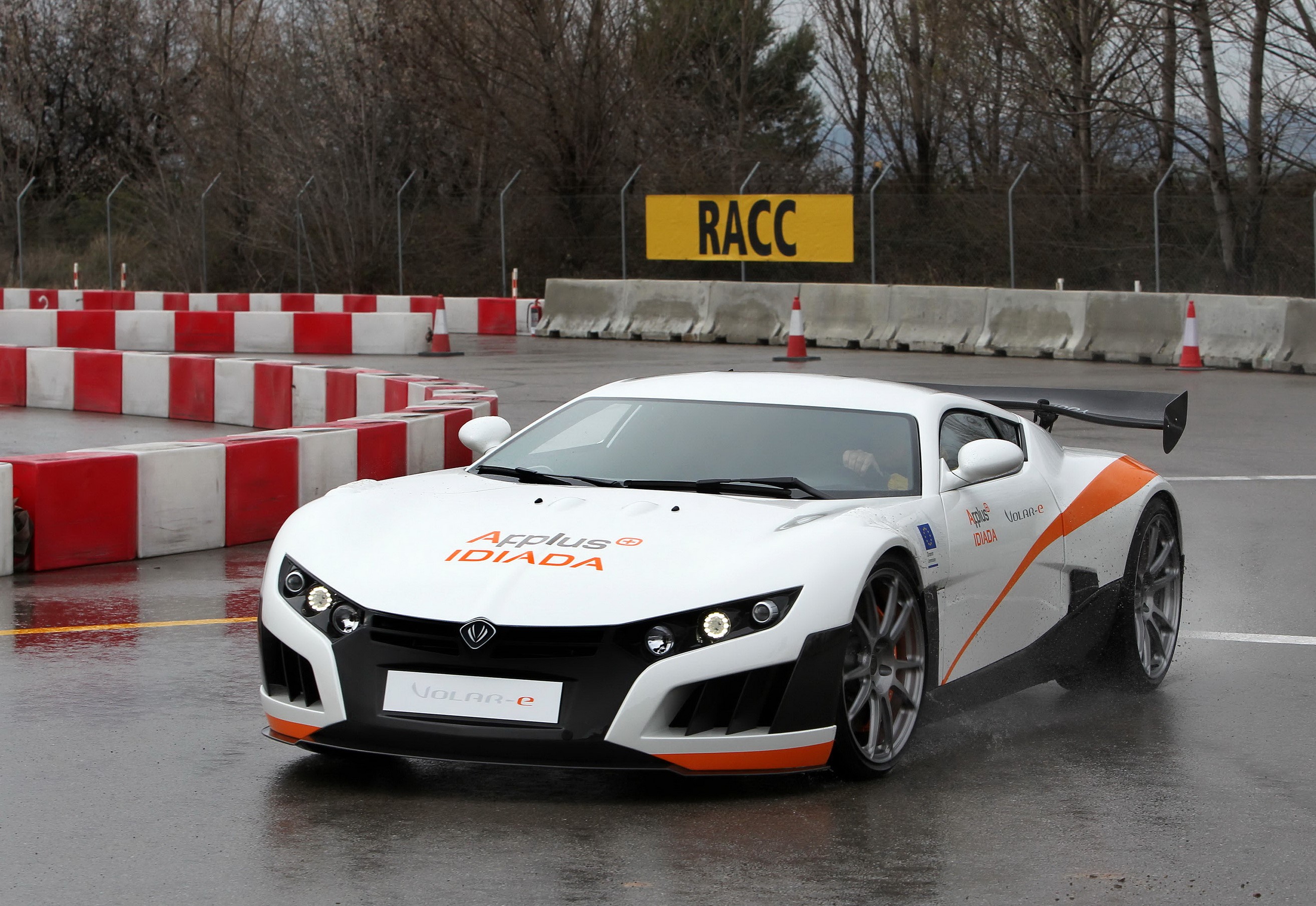 Applus Volar-e electric sports car on a wet track HD Wallpaper
