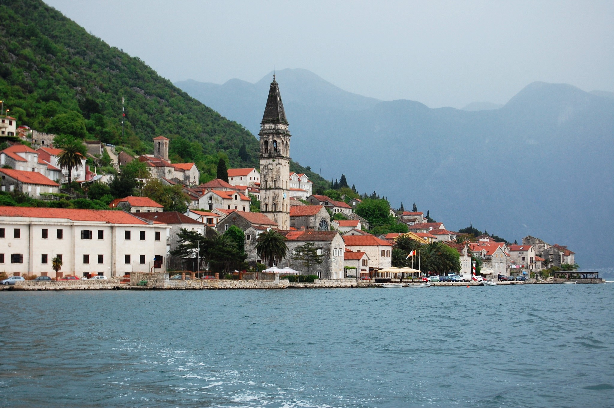 Perast, Montenegro: Coastal town with bell tower and mountains HD Wallpaper
