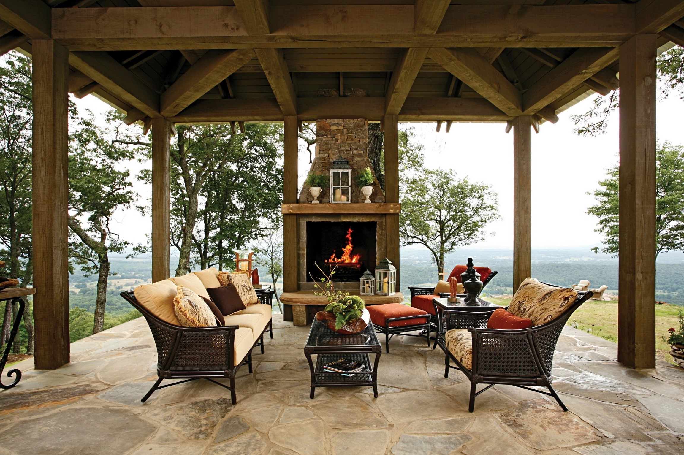 Outdoor living room with fireplace and mountain view HD Wallpaper