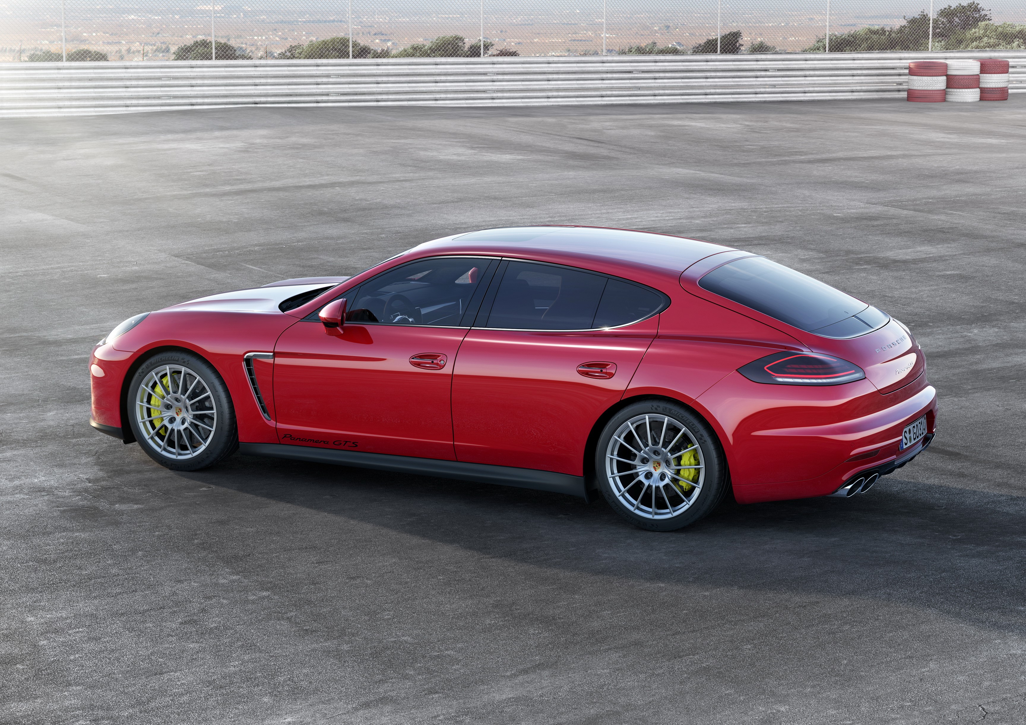 Red 2013 Porsche Panamera GTS on asphalt HD Wallpaper