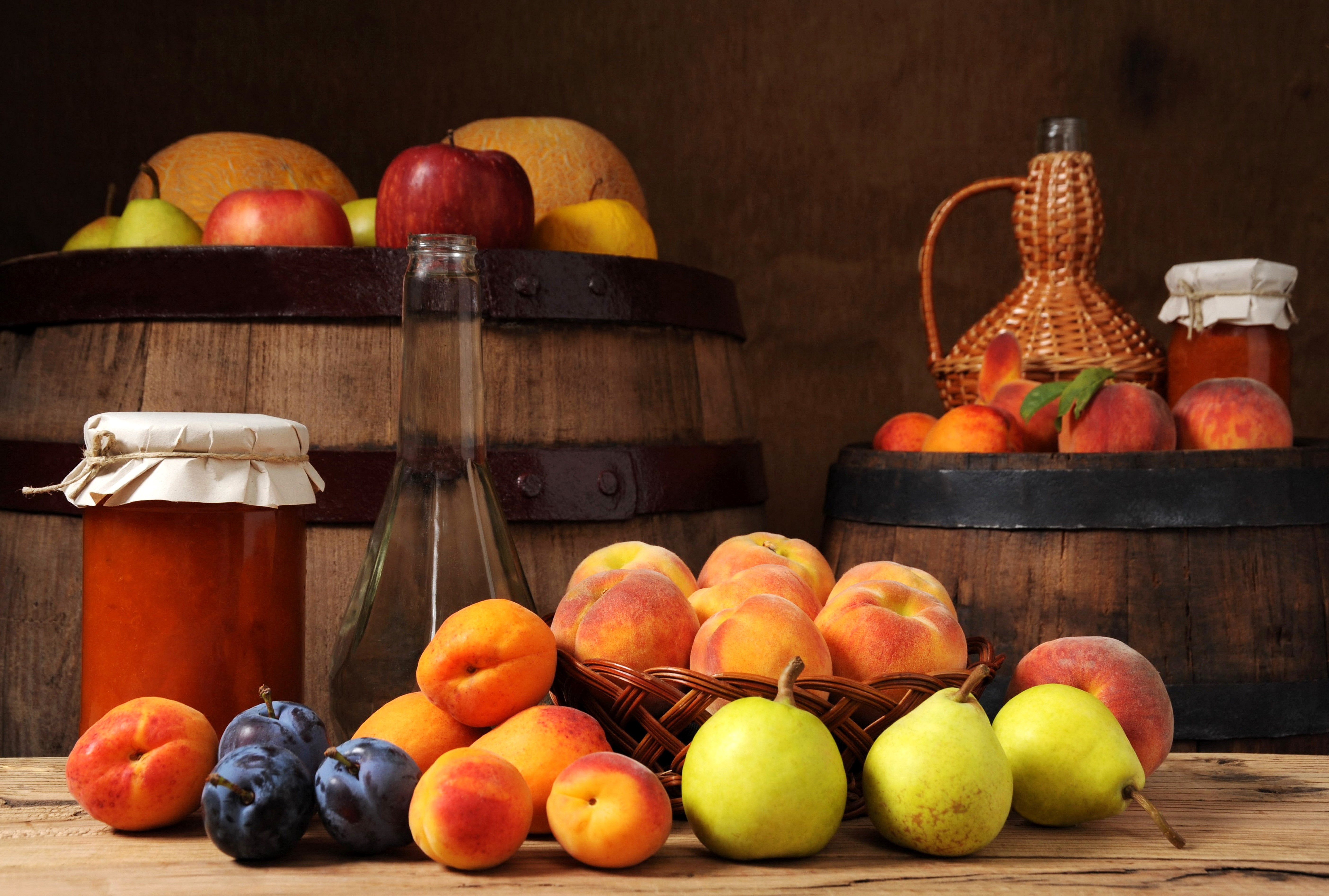 Still-life of fruit and preserves on barrels HD Wallpaper