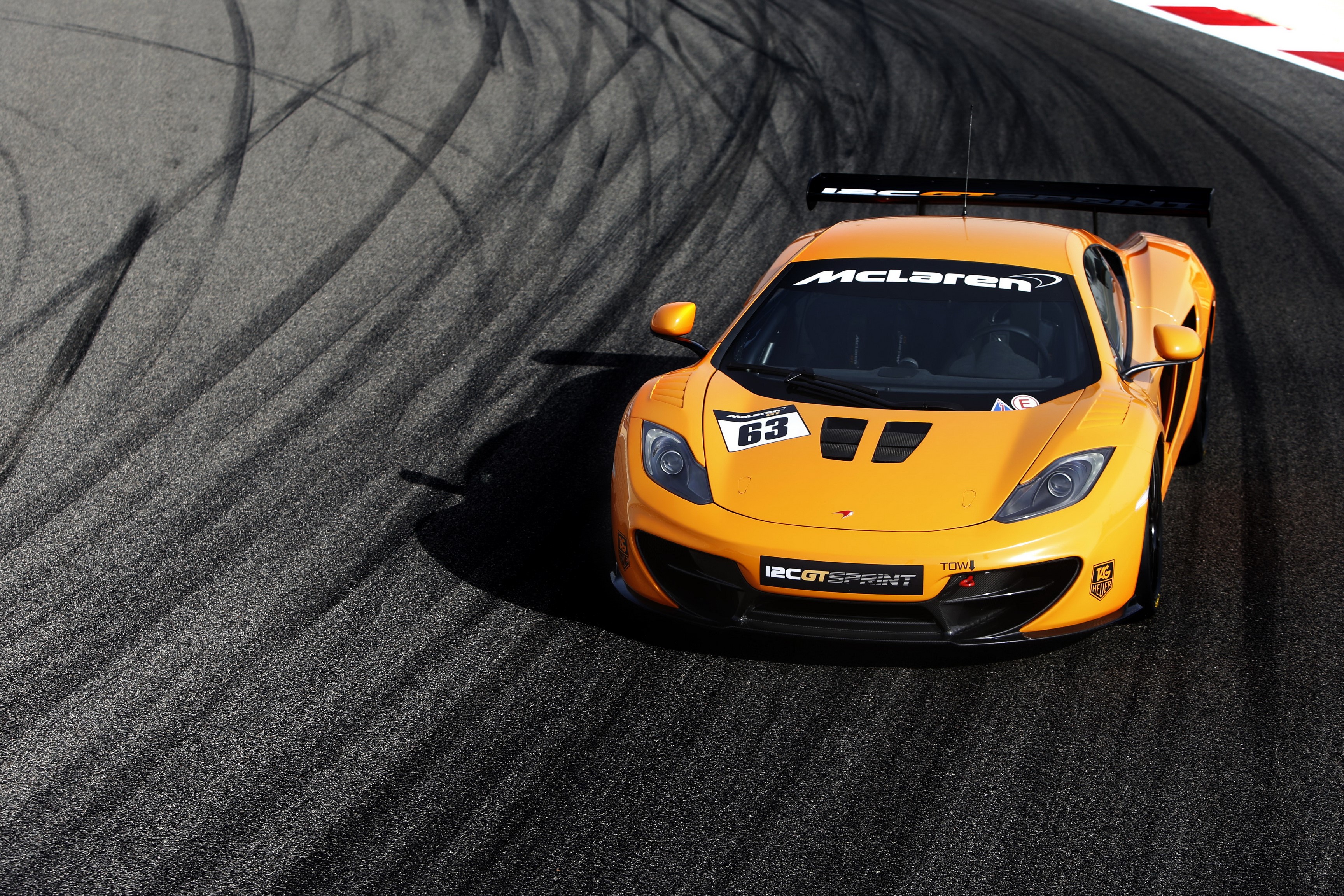 2013 McLaren 12C GT Sprint race car on asphalt HD Wallpaper