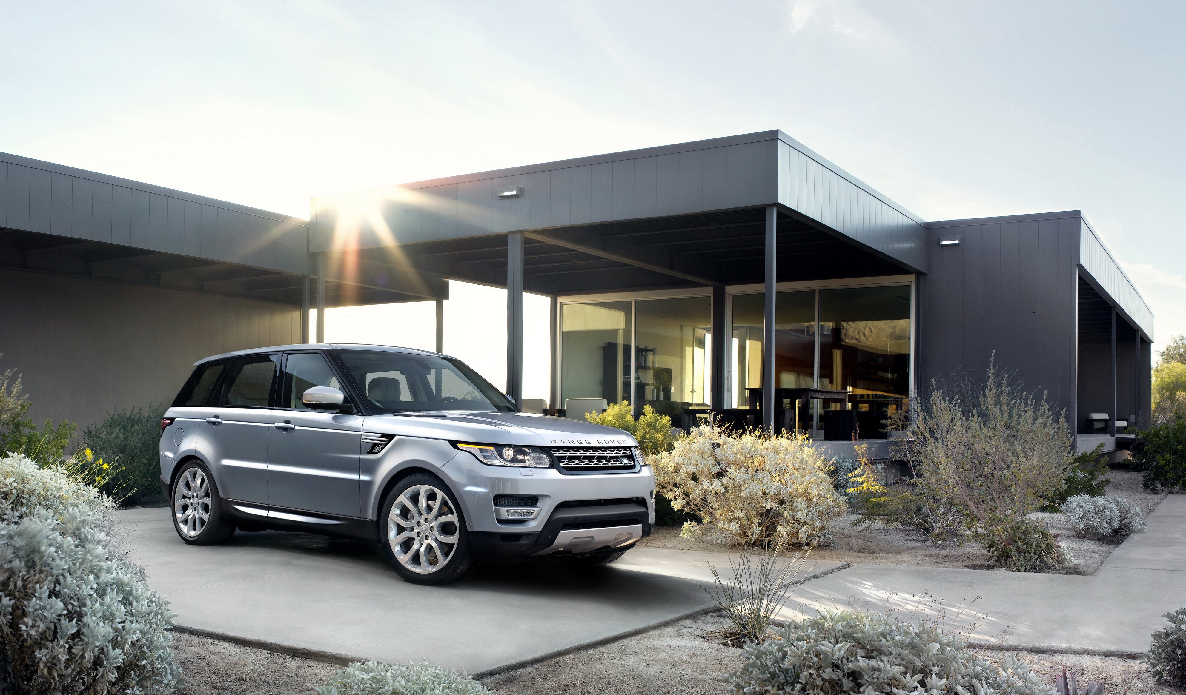 Silver 2014 Range Rover Sport parked at modern mansion HD Wallpaper