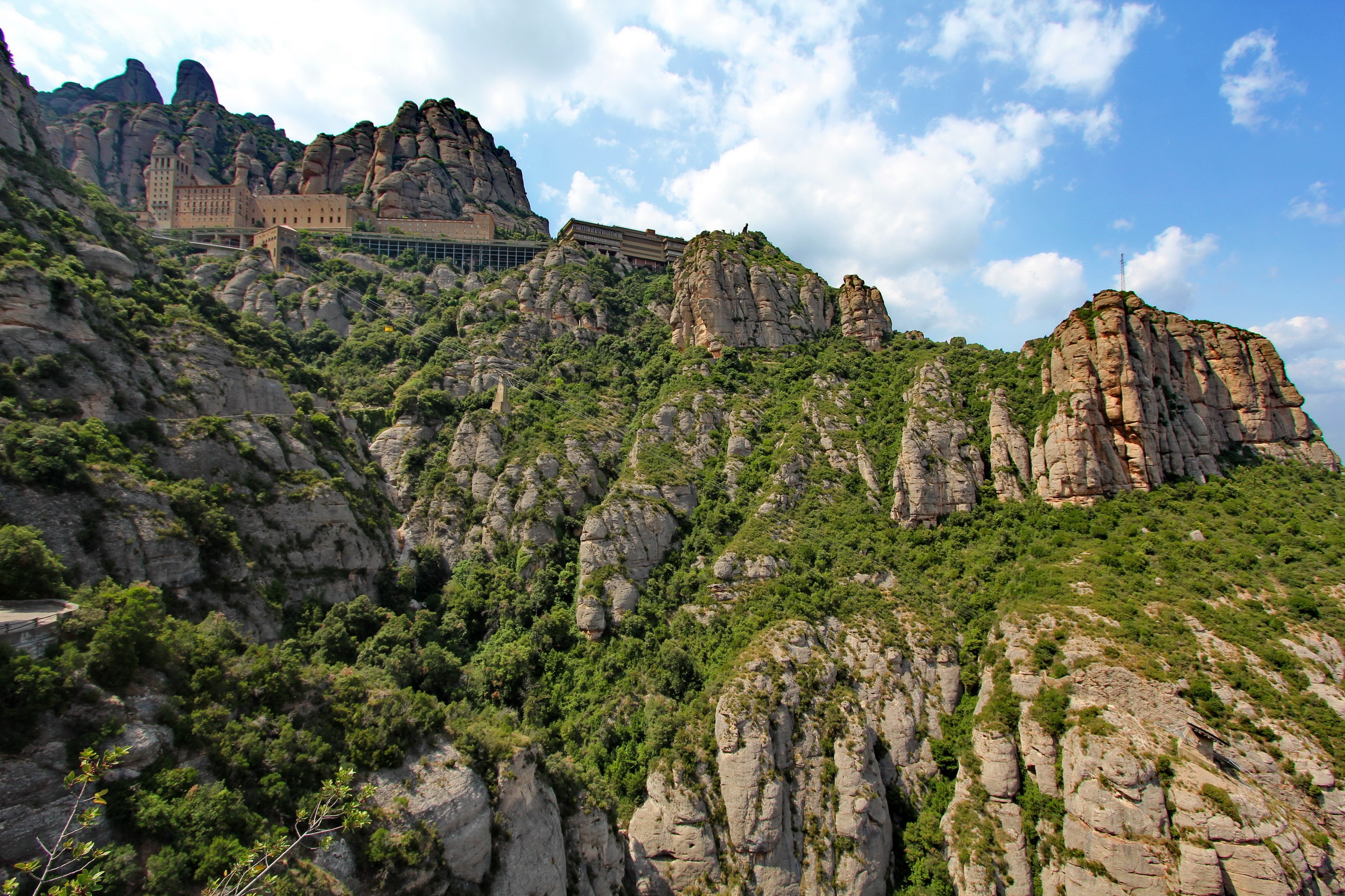 Monastery on the rocky mountains of Montserrat, Spain HD Wallpaper