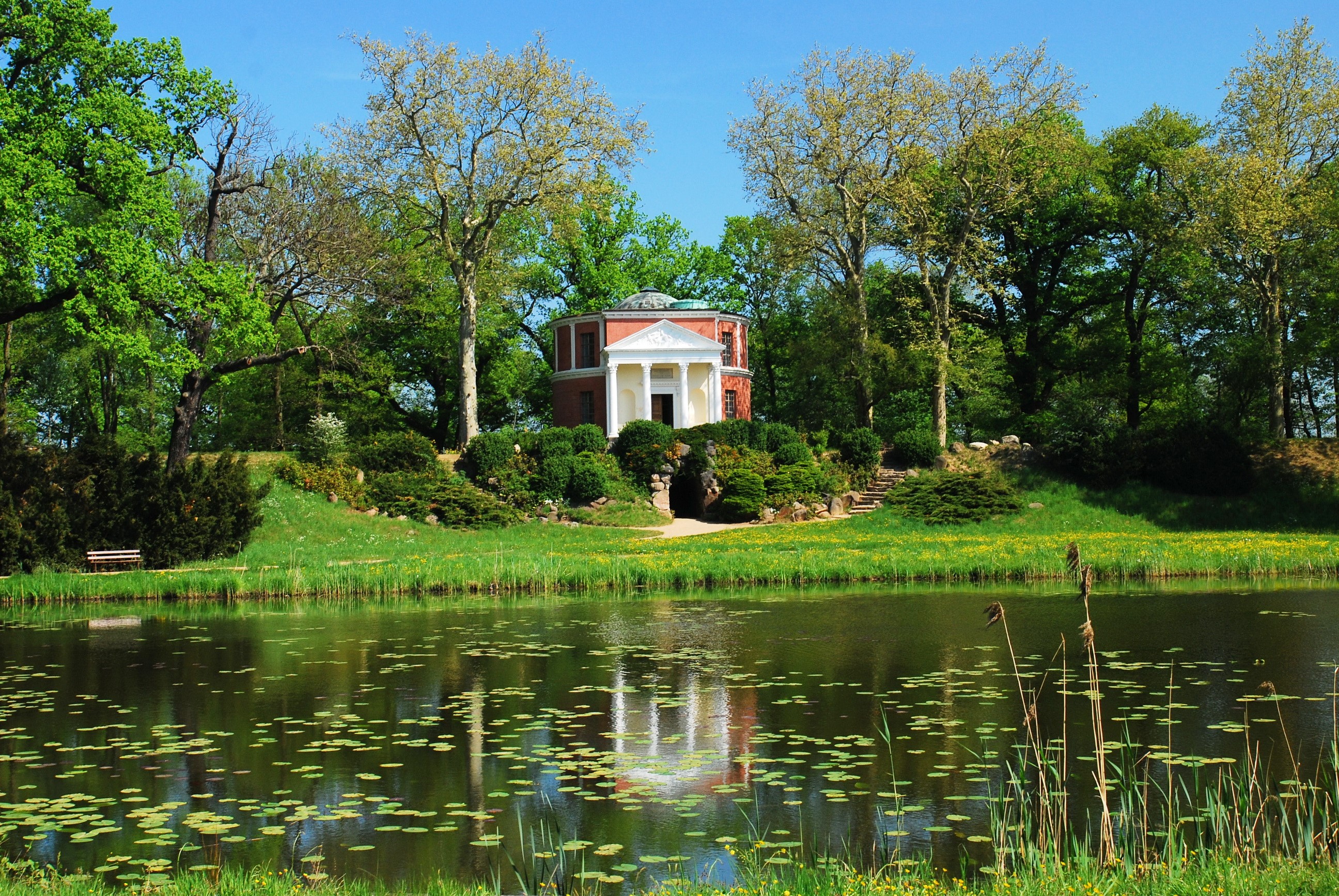 Park with pond and classical building in Germany HD Wallpaper