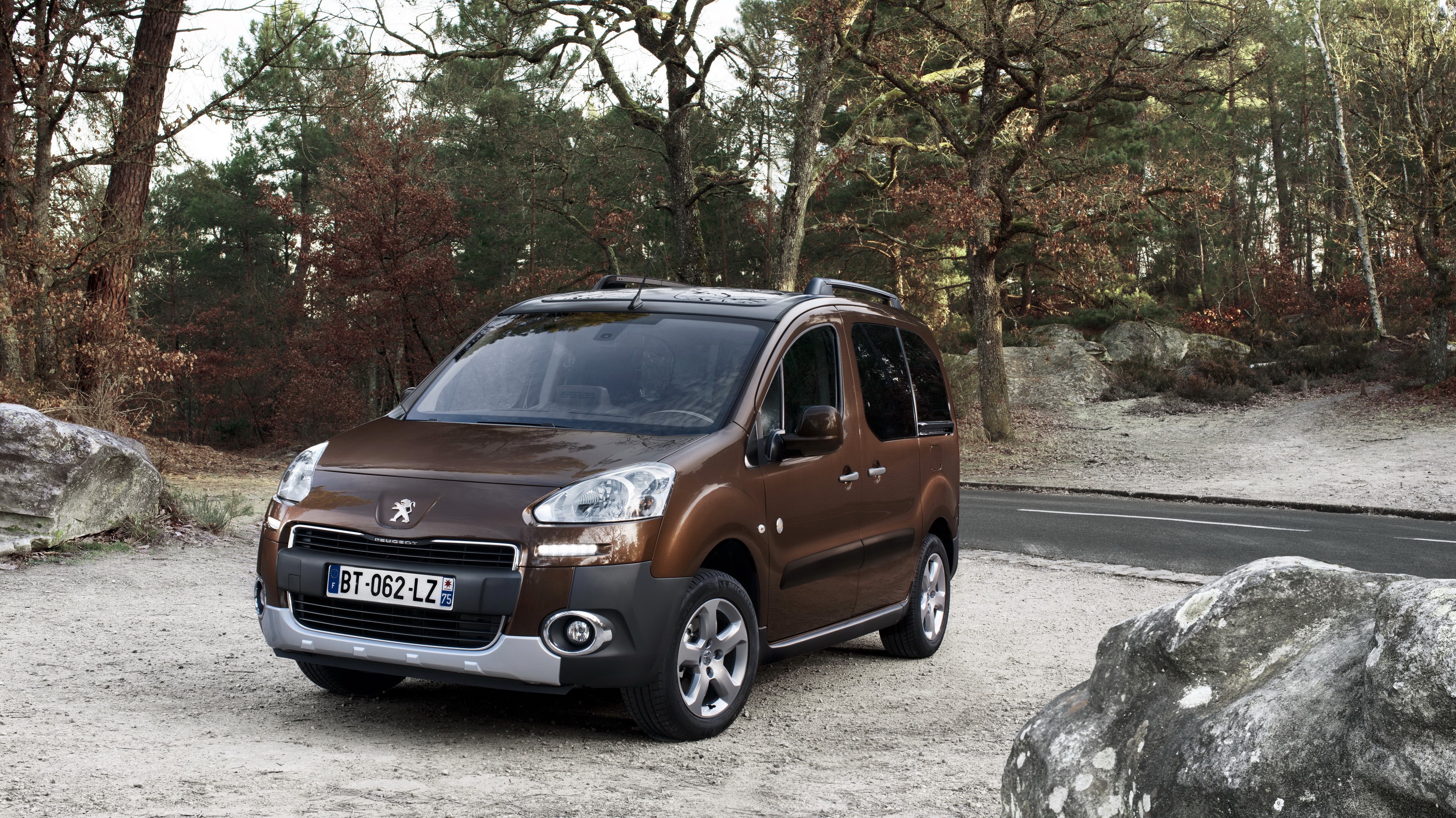 Brown Peugeot Partner Tepee parked on gravel road HD Wallpaper