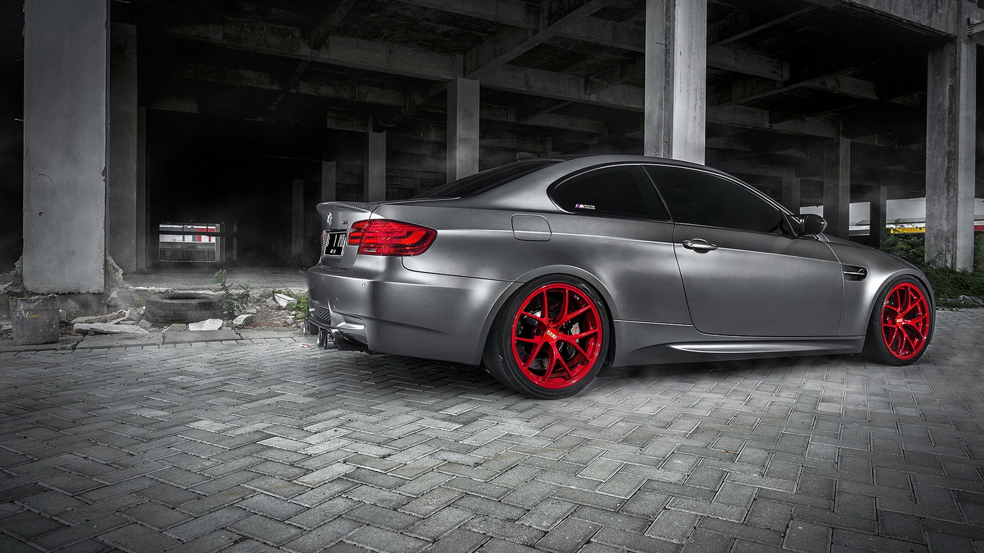 Matte gray BMW M3 with red wheels parked HD Wallpaper
